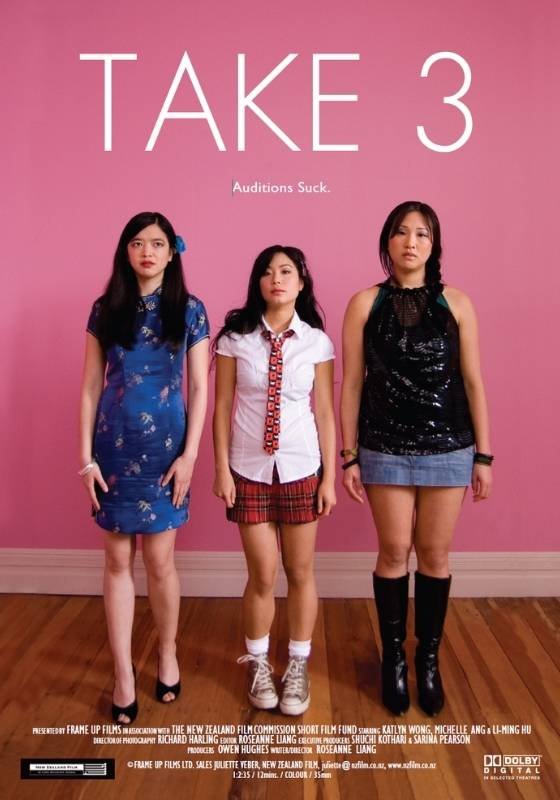 Poster for short film 'Take 3'. Three asian young women standing against a pink wall with the text "TAKE 3" above them and the phrase "Auditions Suck" below. They are dressed in casual to semi-casual clothing.