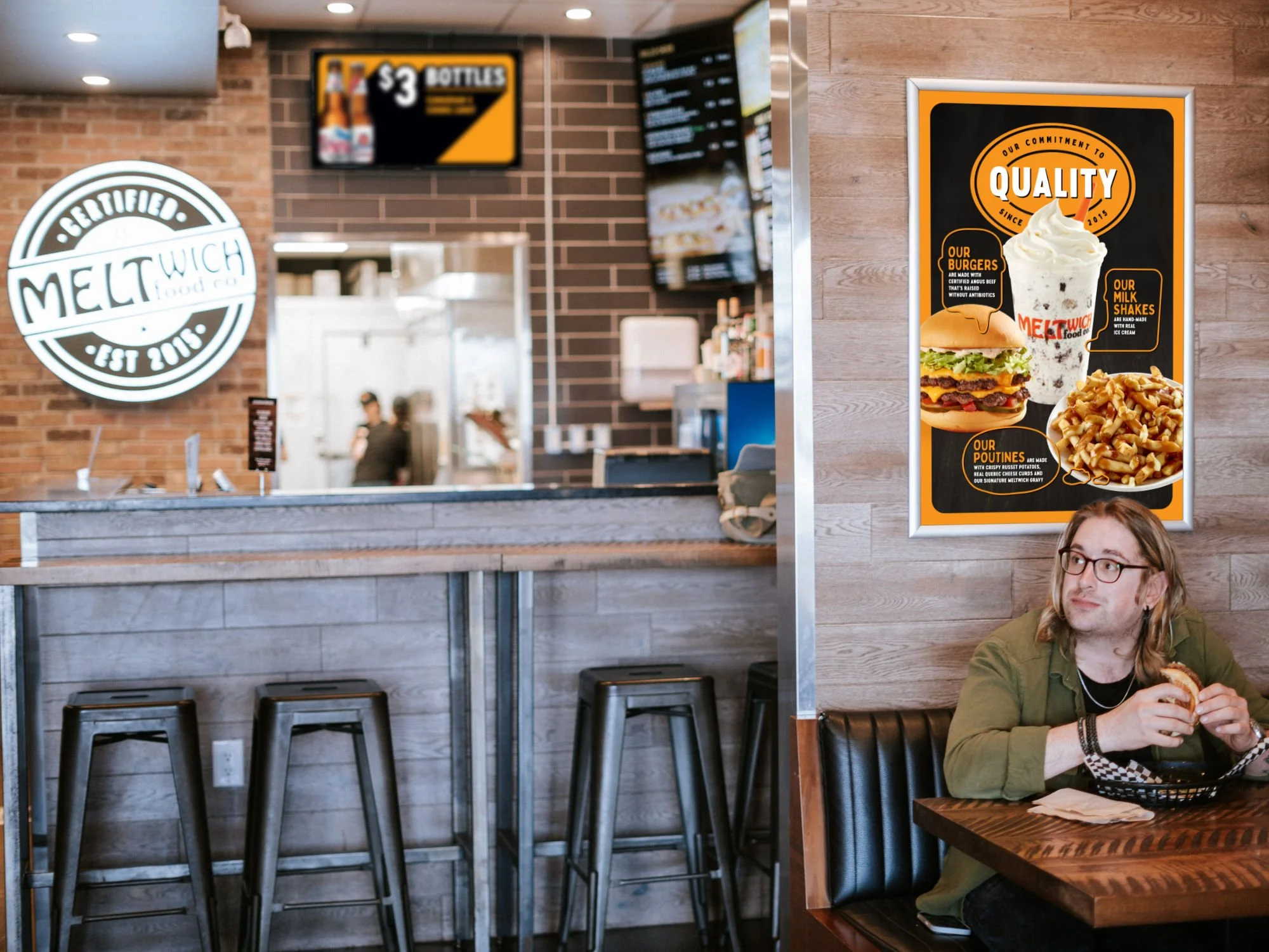 Man eating in Meltwich with signage-mockup_1.jpg