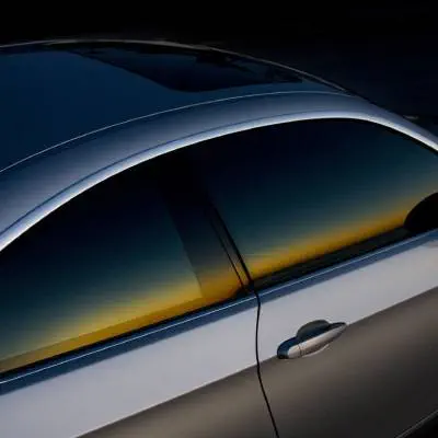 Car with tinted windows at dusk