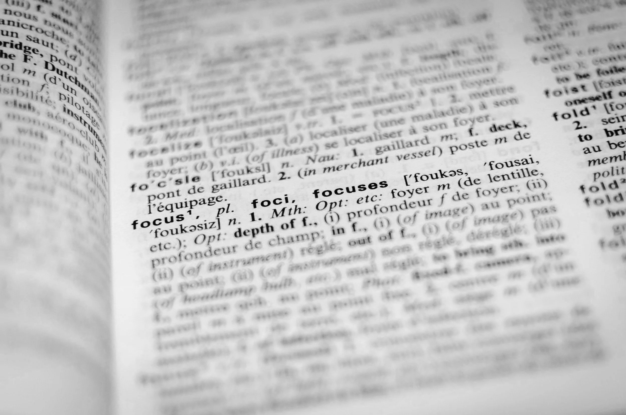 Black-and-white dictionary page with "focus" definition.