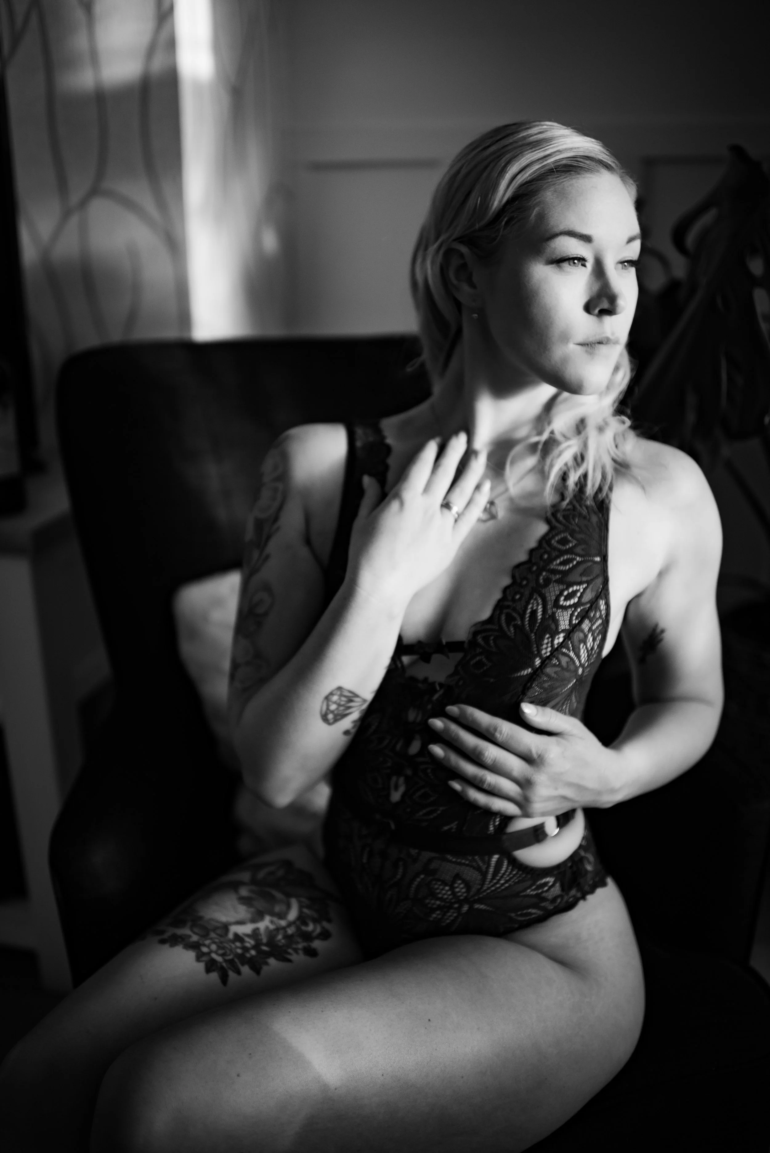 black and white classic image of woman sitting in chair