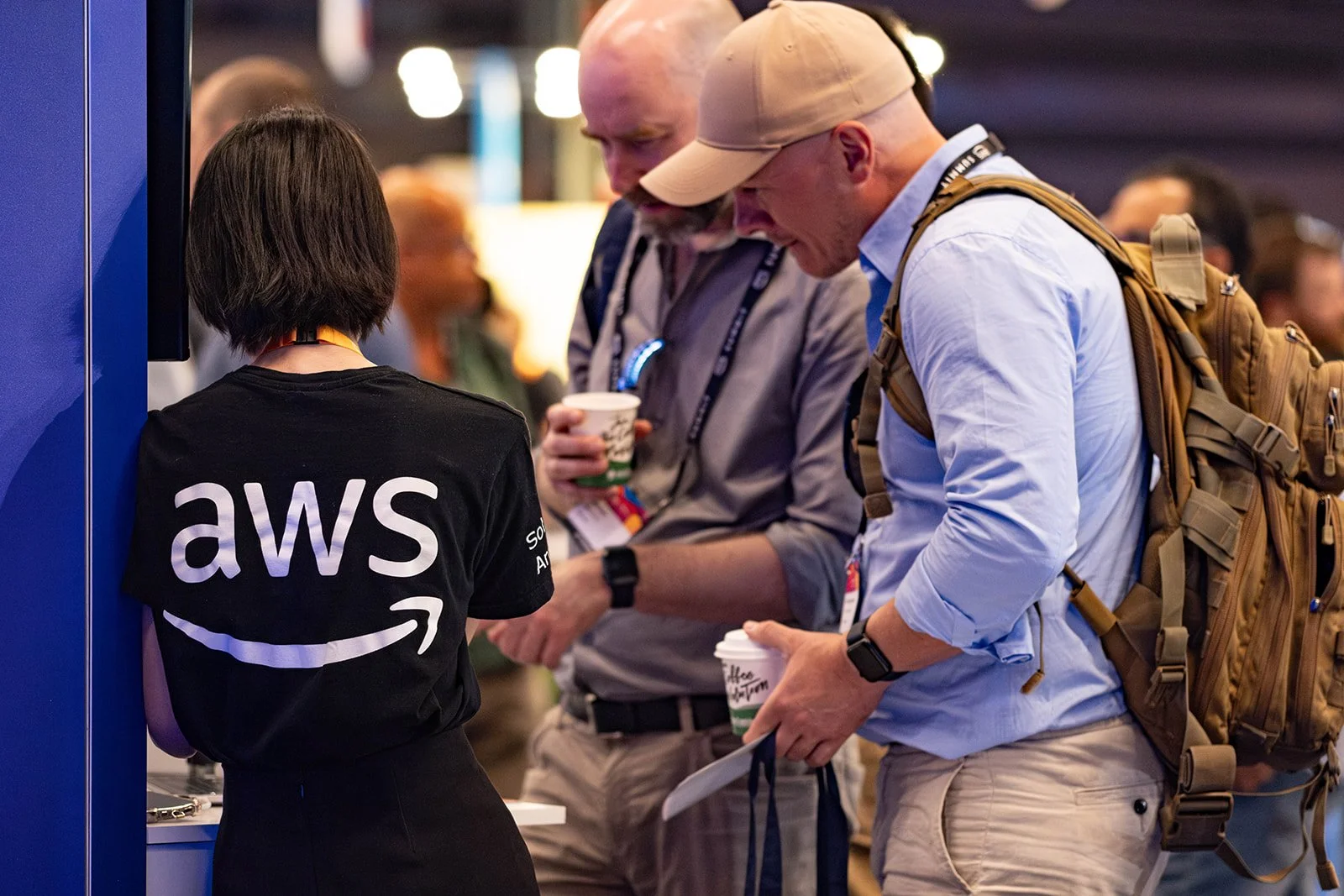 attendees engaging in conversation at large IT event in Stockholm 