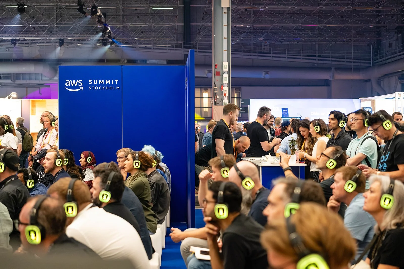 large crowd at event listening with headphones 