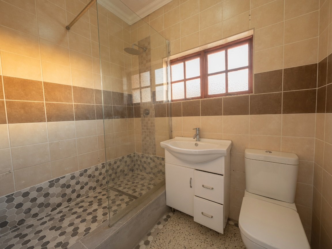 Bathroom with shower at a Luxury 4 Bedroom Double-Storey Home in Phakalane – Nest 165/2026