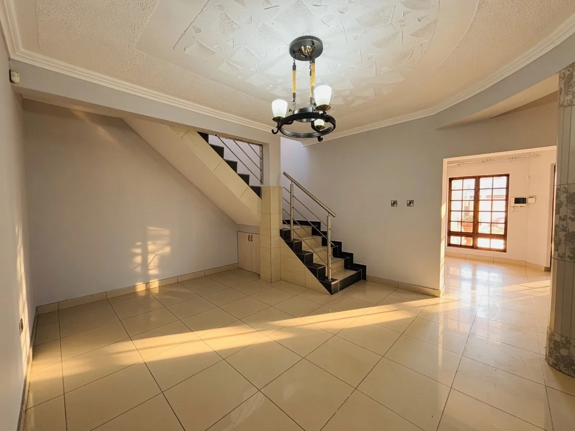 Open lounge and stairway at a Luxury 4 Bedroom Double-Storey Home in Phakalane – Nest 165/2026