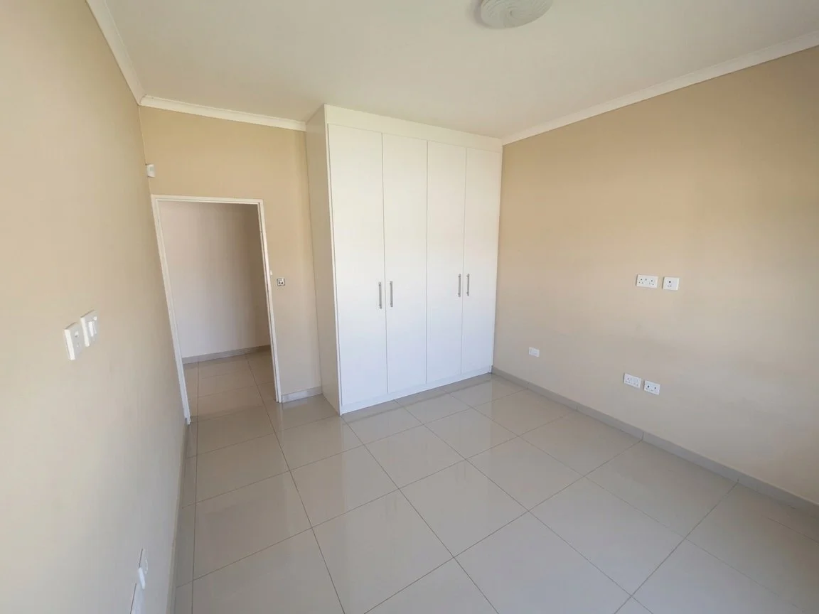 This beautiful Tlokweng home offers great value, comfortable living, and modern security features. Her the bedroom with wardrobes.