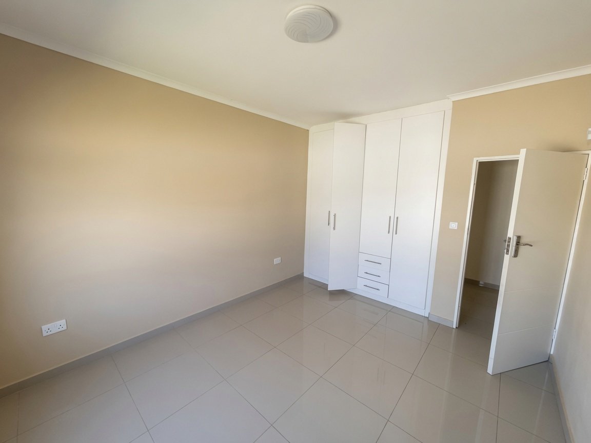 Bedroom with wardrobes at this beautiful 3-bedroom rental in Tlokweng.