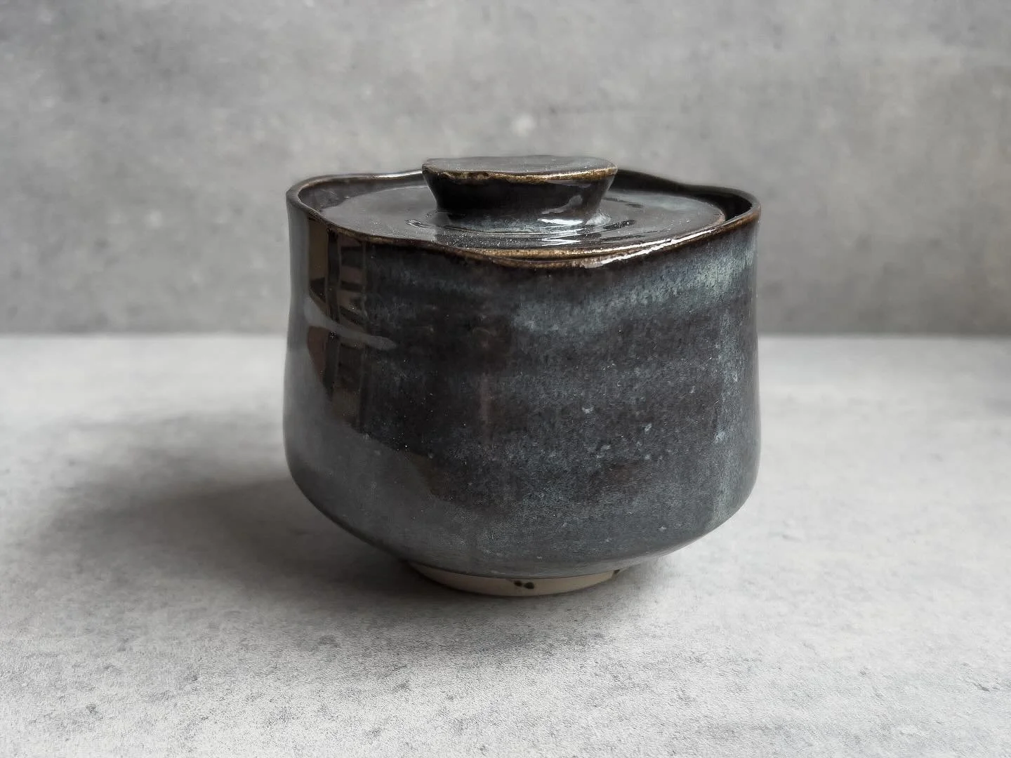 A recent small lidded jar with my new favourite glaze. I was playing with the shape of the body and the sunken  lid with an idea to use these in a tea pot. #pottery #lesgets #morzine #samoens #handmadepottery #stonewarepottery #funtionalpottery