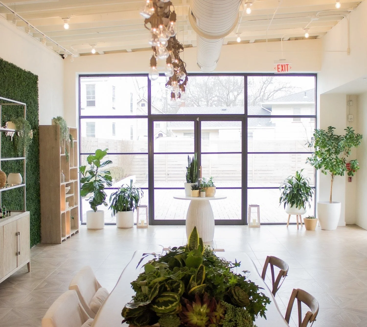 Meeting Table in Loopwell's Apothecary, View of Parking lot, floor to ceiling windows. Shelves for marketplace product to display. For World Cup Experience 7 miles away from MetLife Stadium. Premium experience right here for FIFA in New Jersey.
