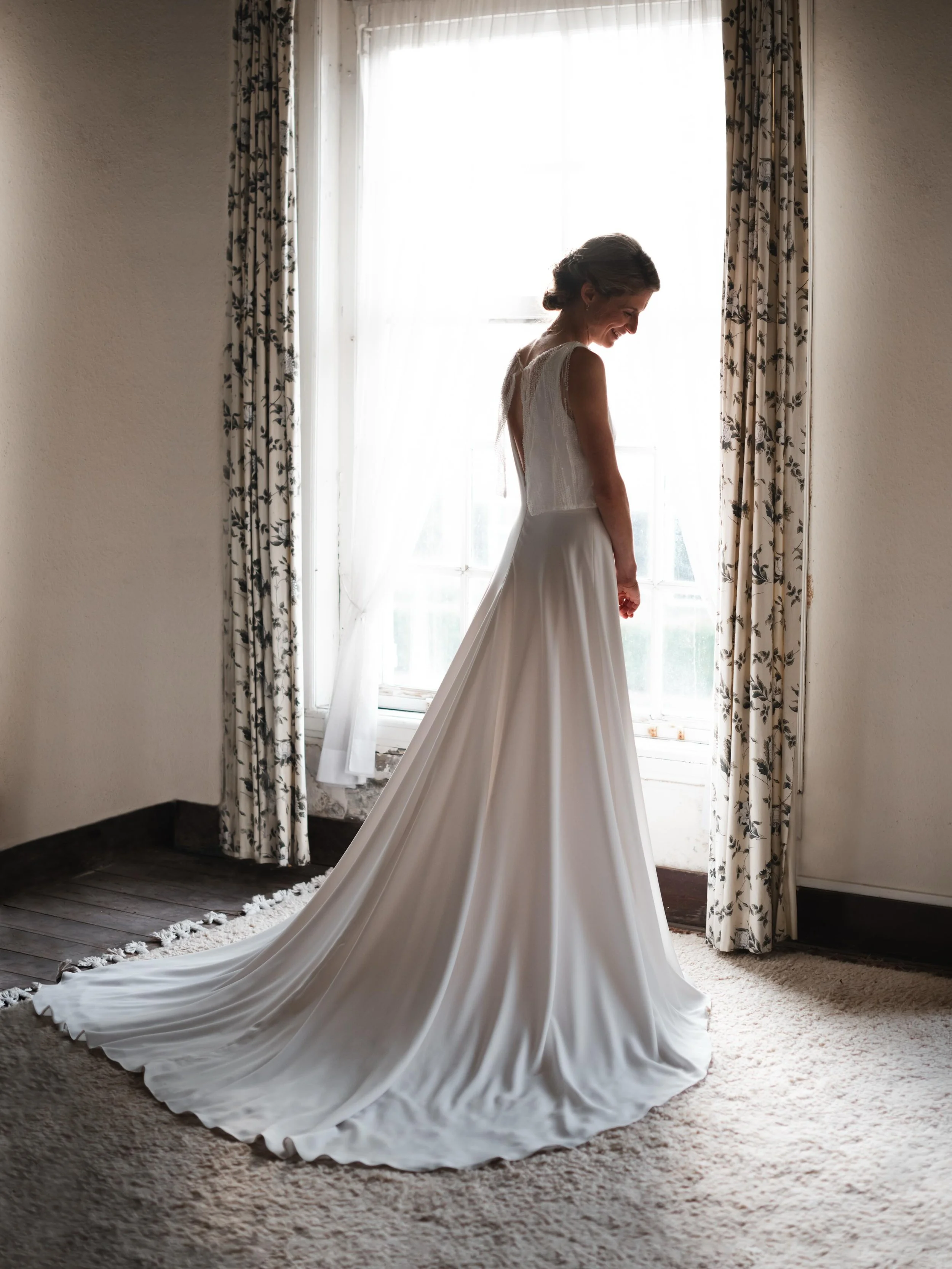 I absolutely love this bridal portrait of Carlijn - not only because she looks breathtaking in the soft light, but because it captures a rare quiet moment she took for herself before the laughter, celebrations, and chaos of the wedding breakfast bega