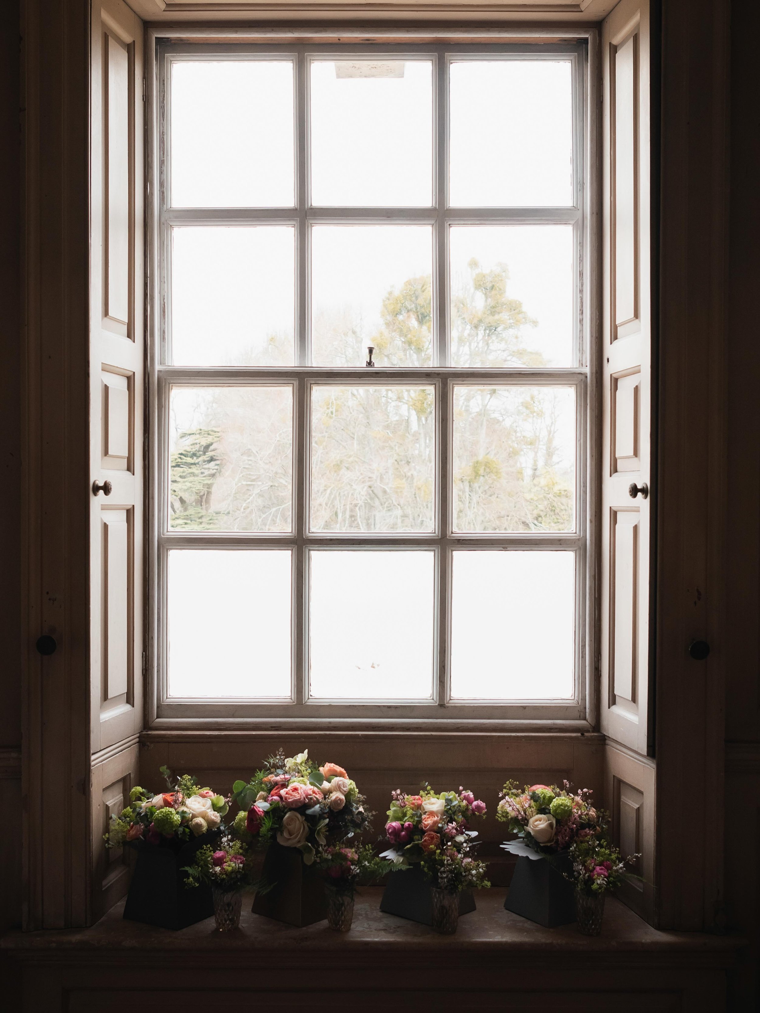 I never really plan to focus on the flowers at a wedding&hellip;but somehow I always end up doing it.

The bouquet gripped a little tighter before the ceremony. 
Petals fallen whilst walking up the aisle. 
Centrepieces catching the light during speec