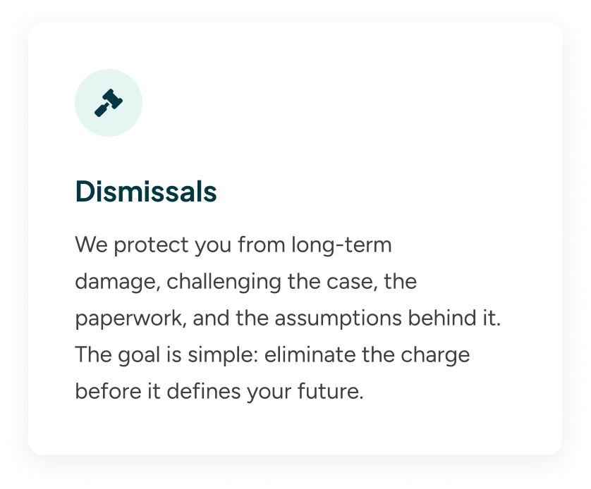 A digital screen displays a section titled "Dismissals" with a paragraph explaining protection from long-term damage, challenging cases, paperwork, and assumptions, emphasizing eliminating charges before they shape your future.