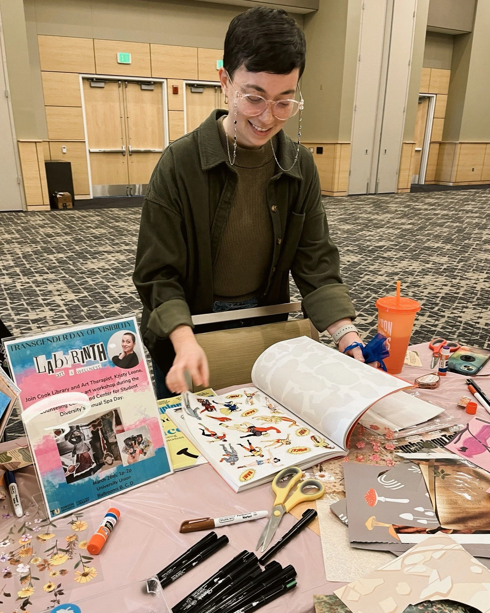 Art therapist near Roland Park, Maryland leading a mental health workshop on collage journaling.