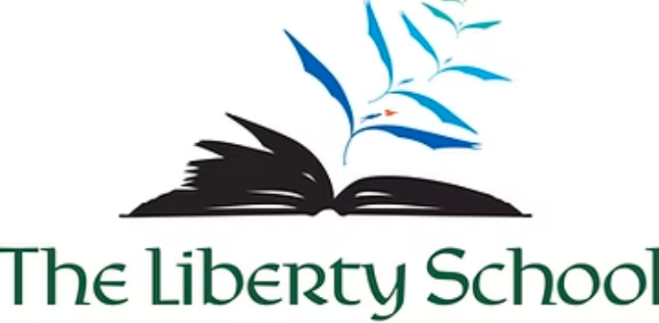A logo for The Liberty School featuring an open book with blue and black stylized birds flying out.
