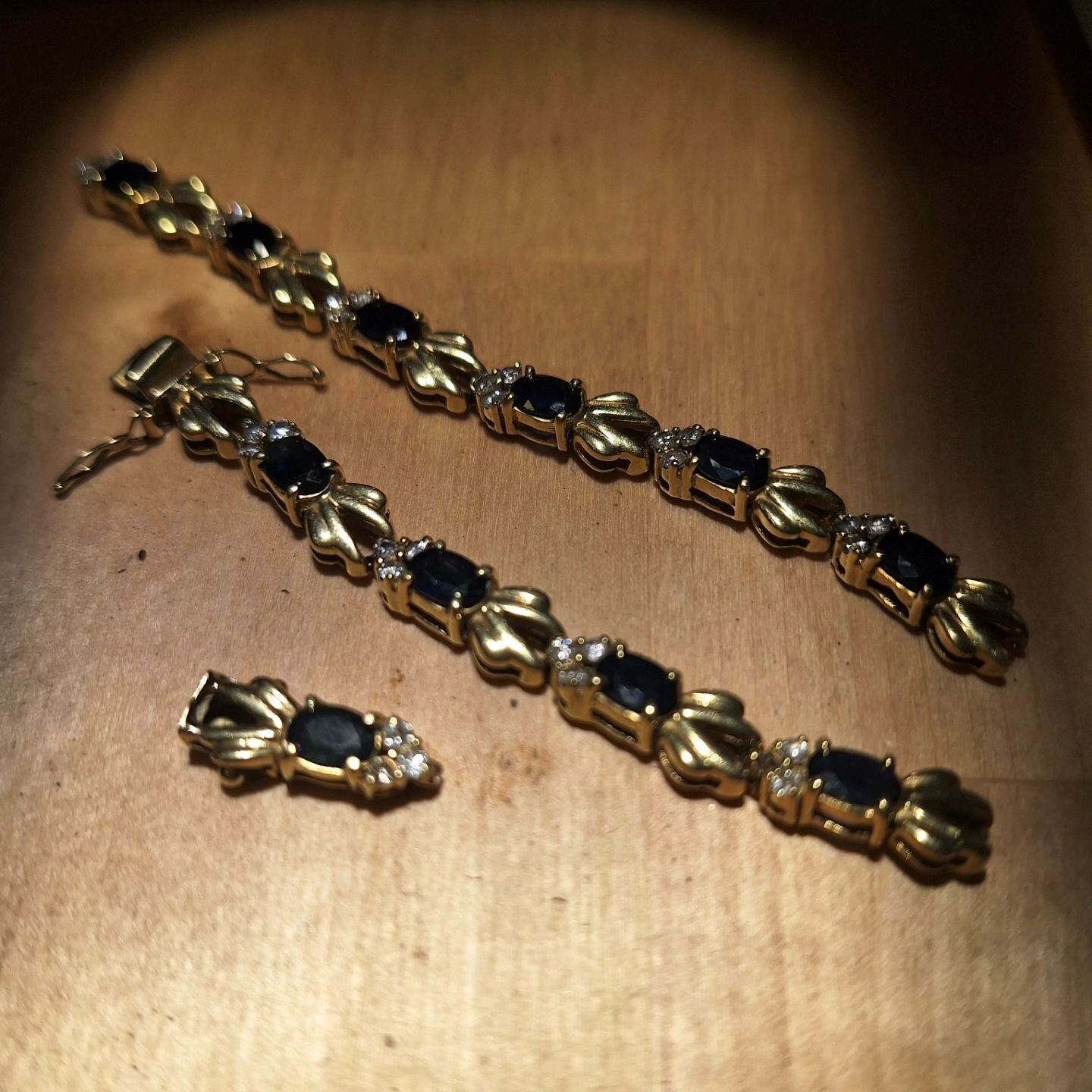 This much loved sapphire and diamond bracelet has been cherished for multiple generations, and the gold finally wore through on some of the links and a stone was missing. Two sections of links were rebuilt and repaired, and the missing diamond replac