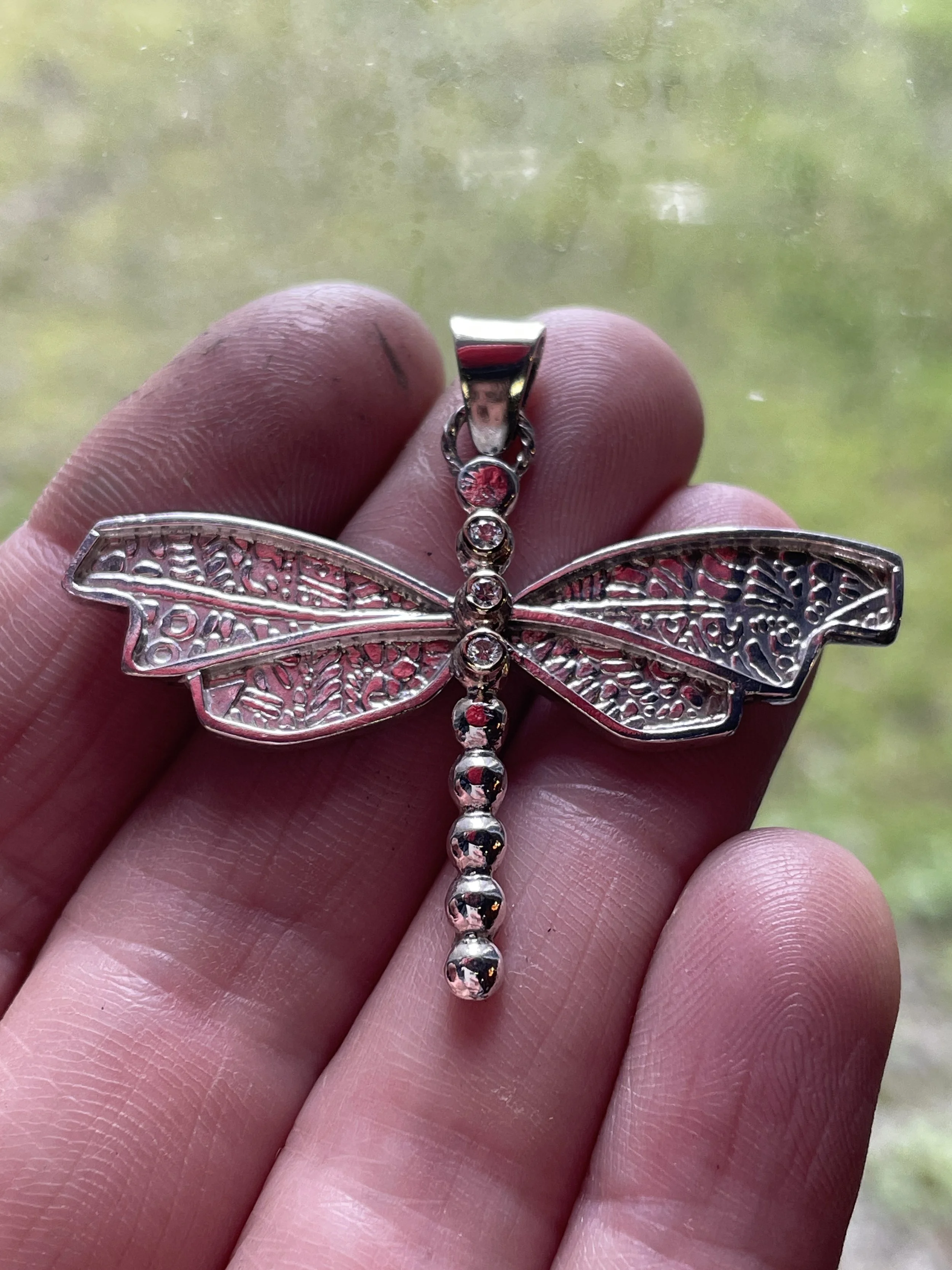 14K Gold and Sterling silver dragonfly pendant with three lab grown diamonds representing family.