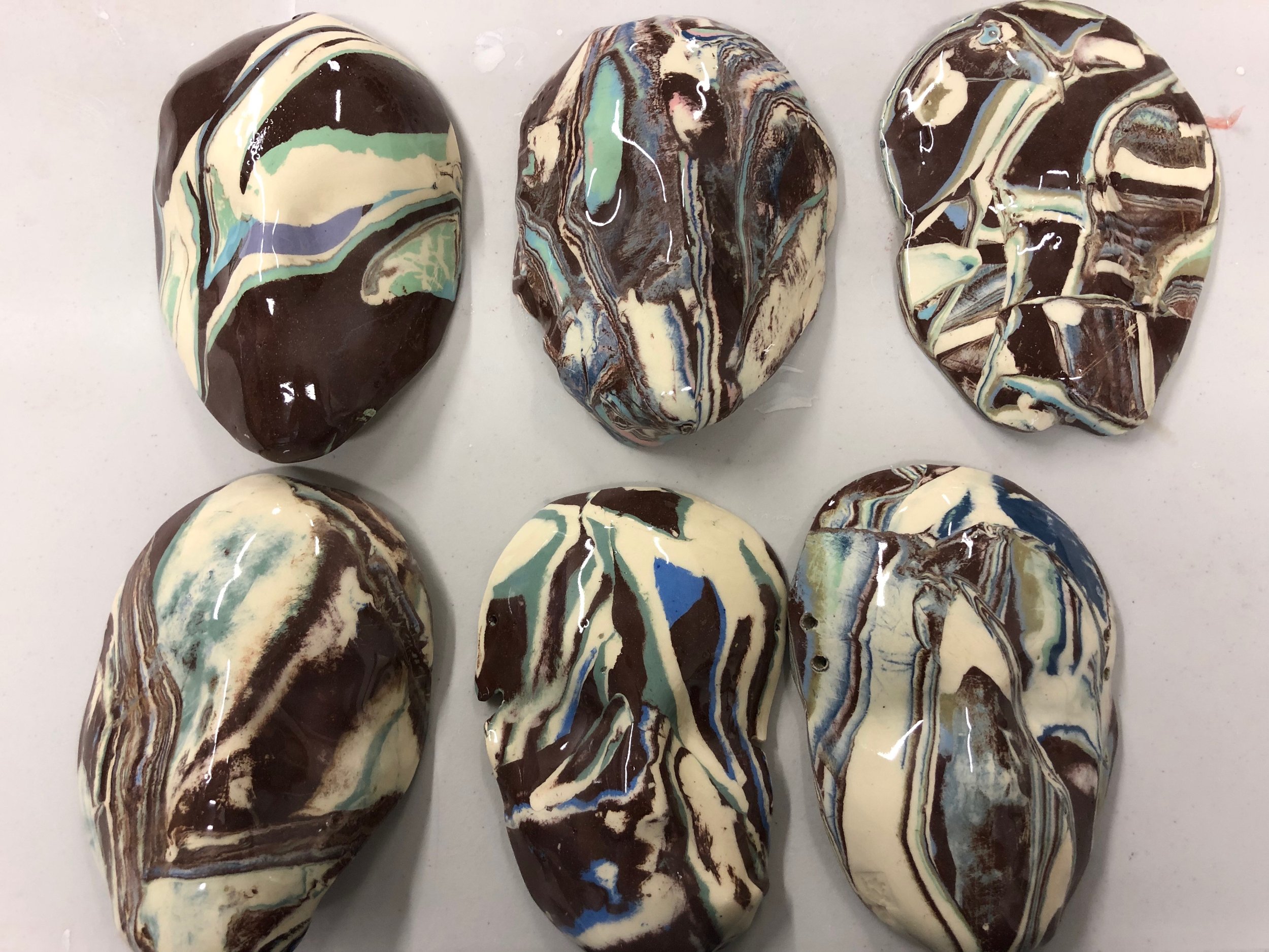 faces in clay.jpeg