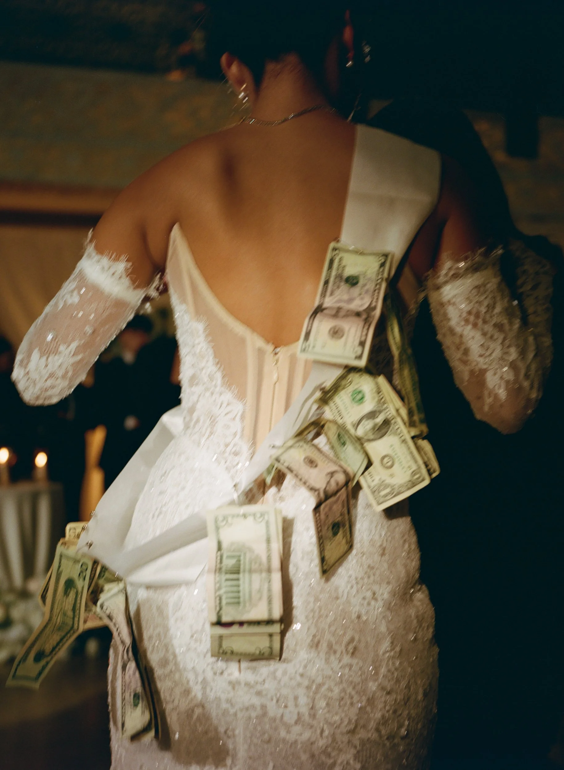 bride with money pinning tradition at wedding