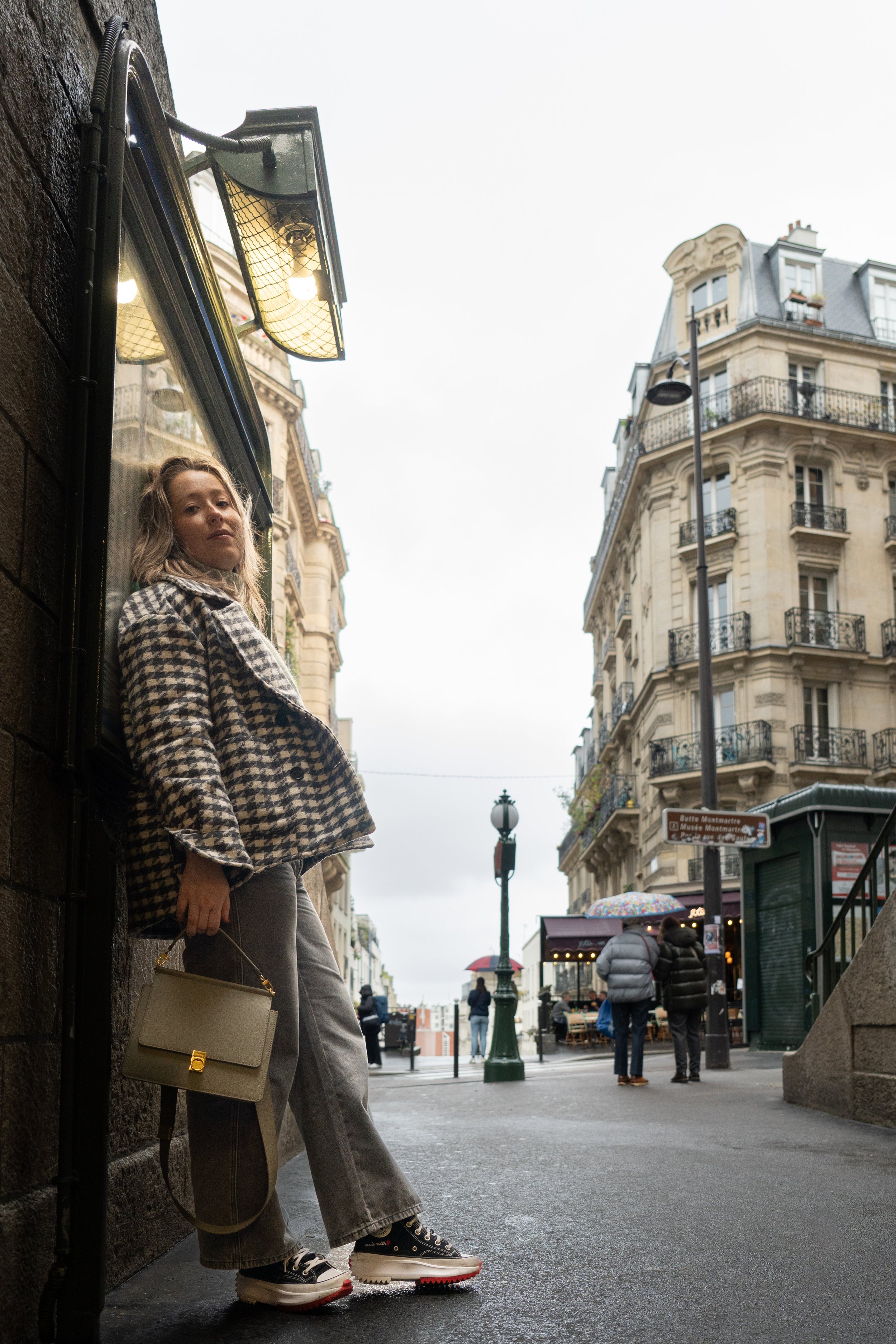  A woman posing during a photo shoot in Paris, France in the Montmartre district.  