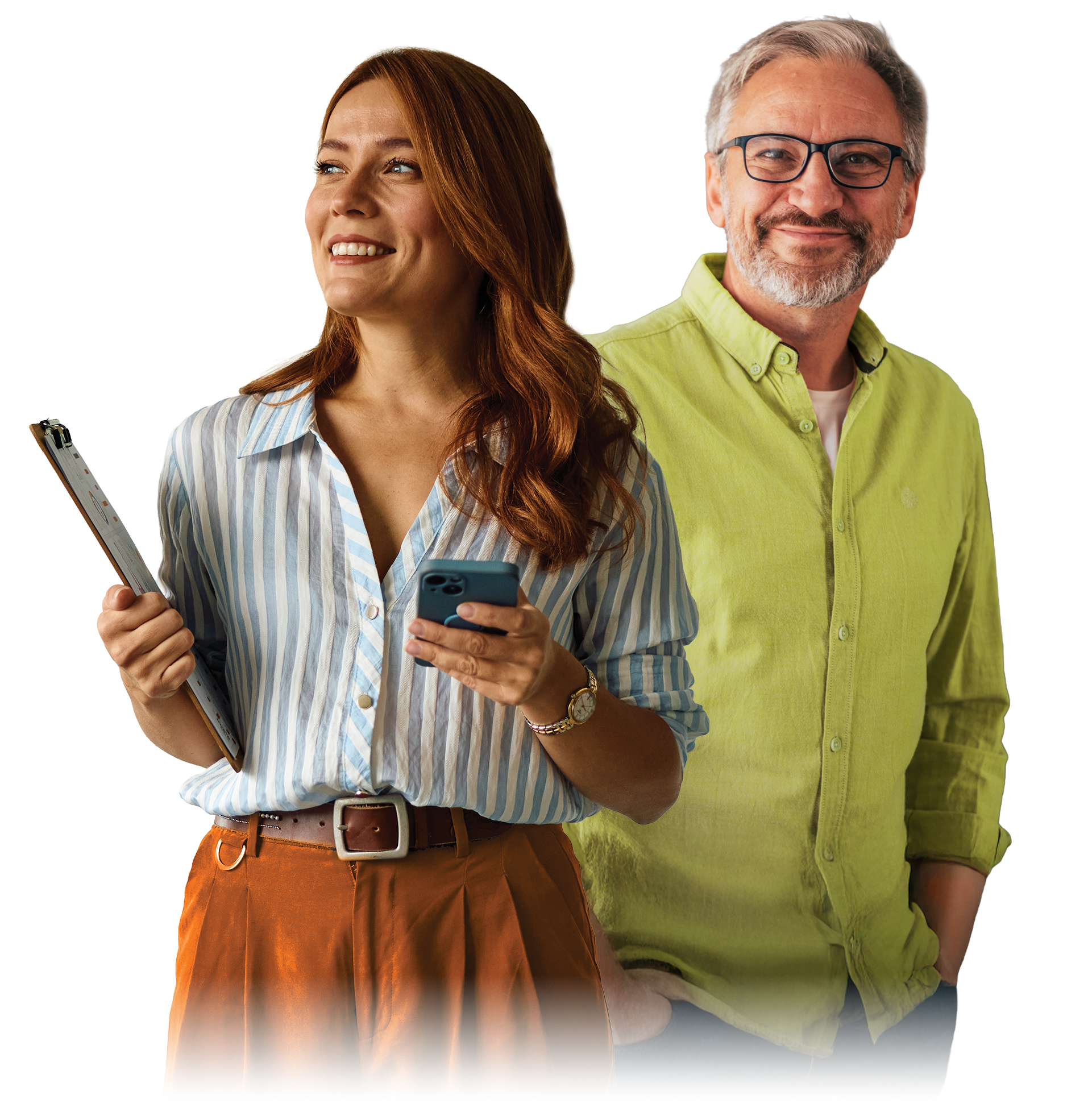 A smiling woman holding a clipboard and a smartphone, standing next to a man with glasses and a beard, wearing a lime green shirt.