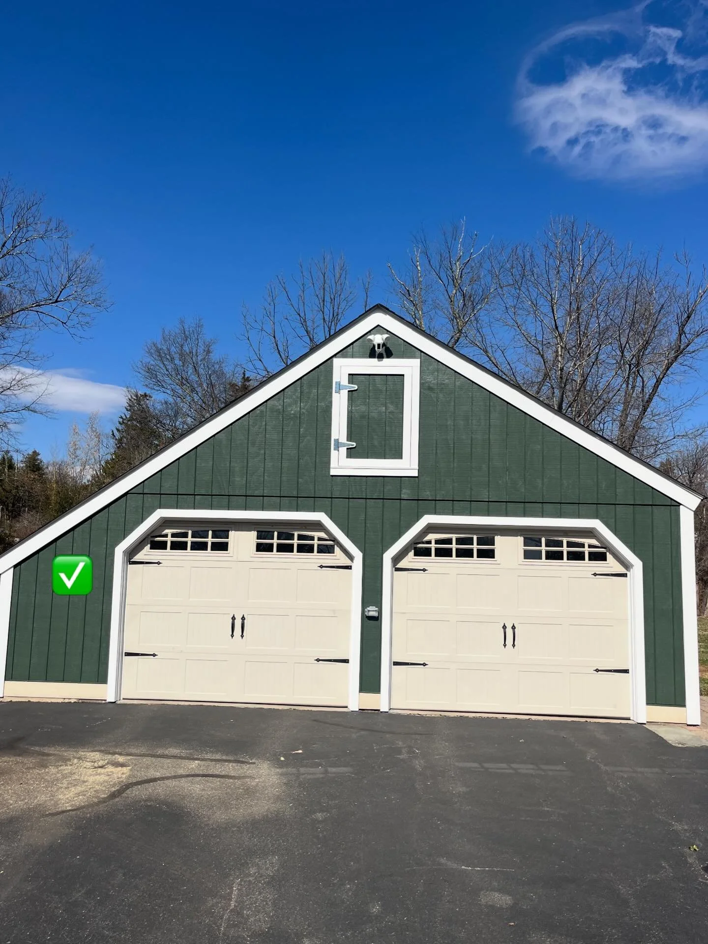 New siding and trim on this garage really pops with that deep dark green paint!