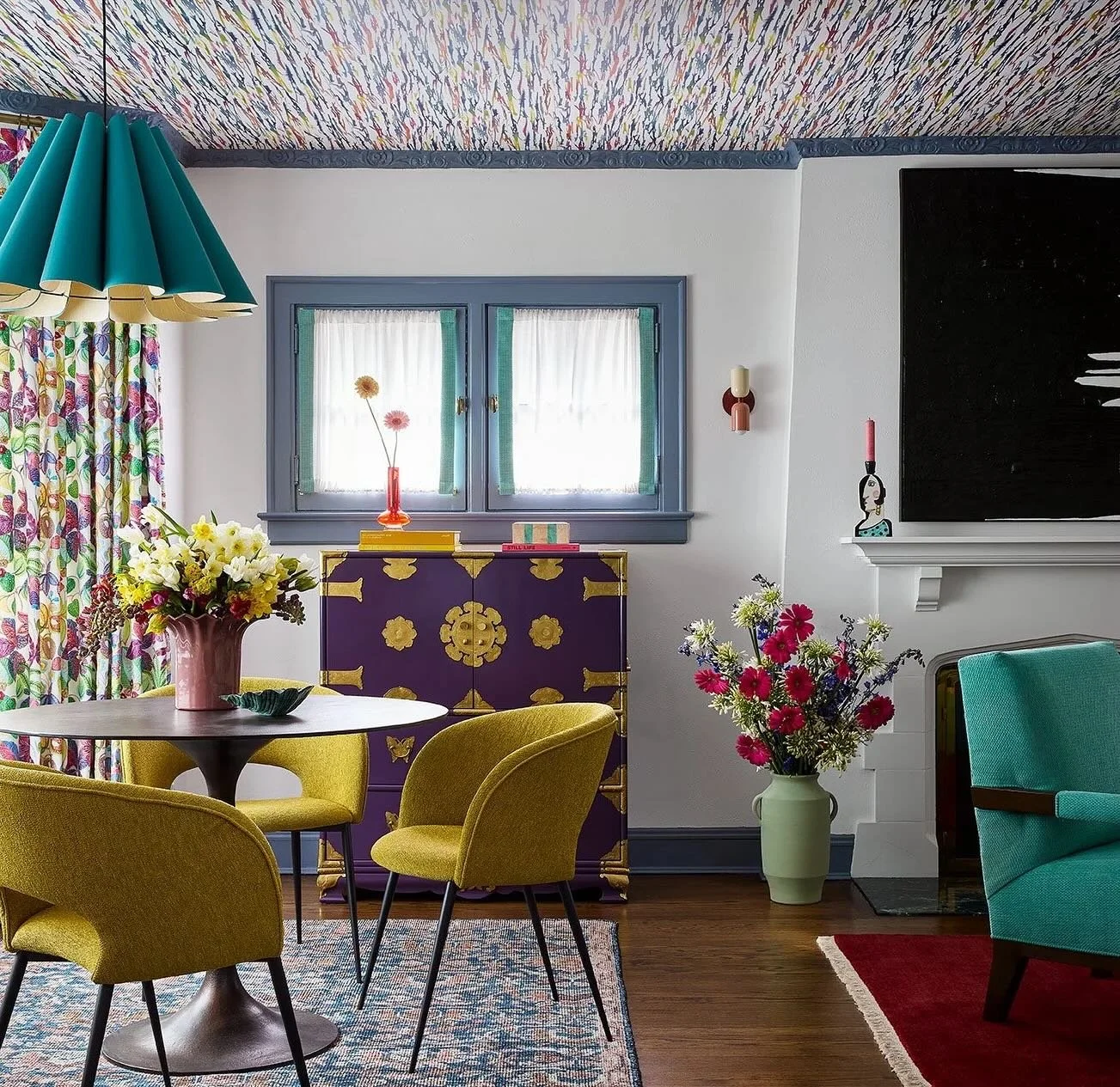 What&rsquo;s the best way to break up a long living room? Using rugs to designate different spaces! In the #RainbowRefuge living room, we created two distinct zones in their space. A bistro table and chairs by the windows is the perfect space for a m