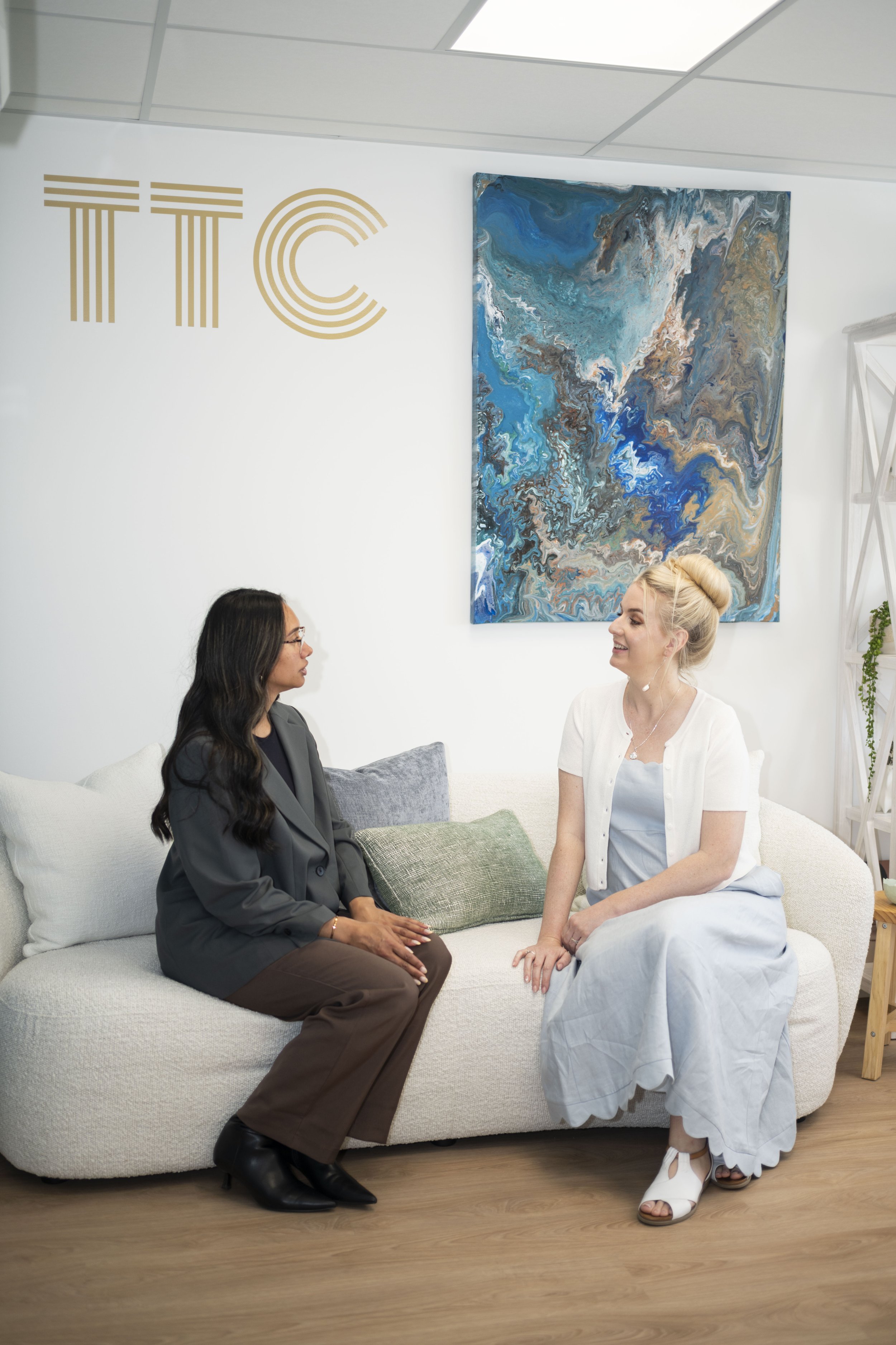 Gina speaking with a client during a consultation.