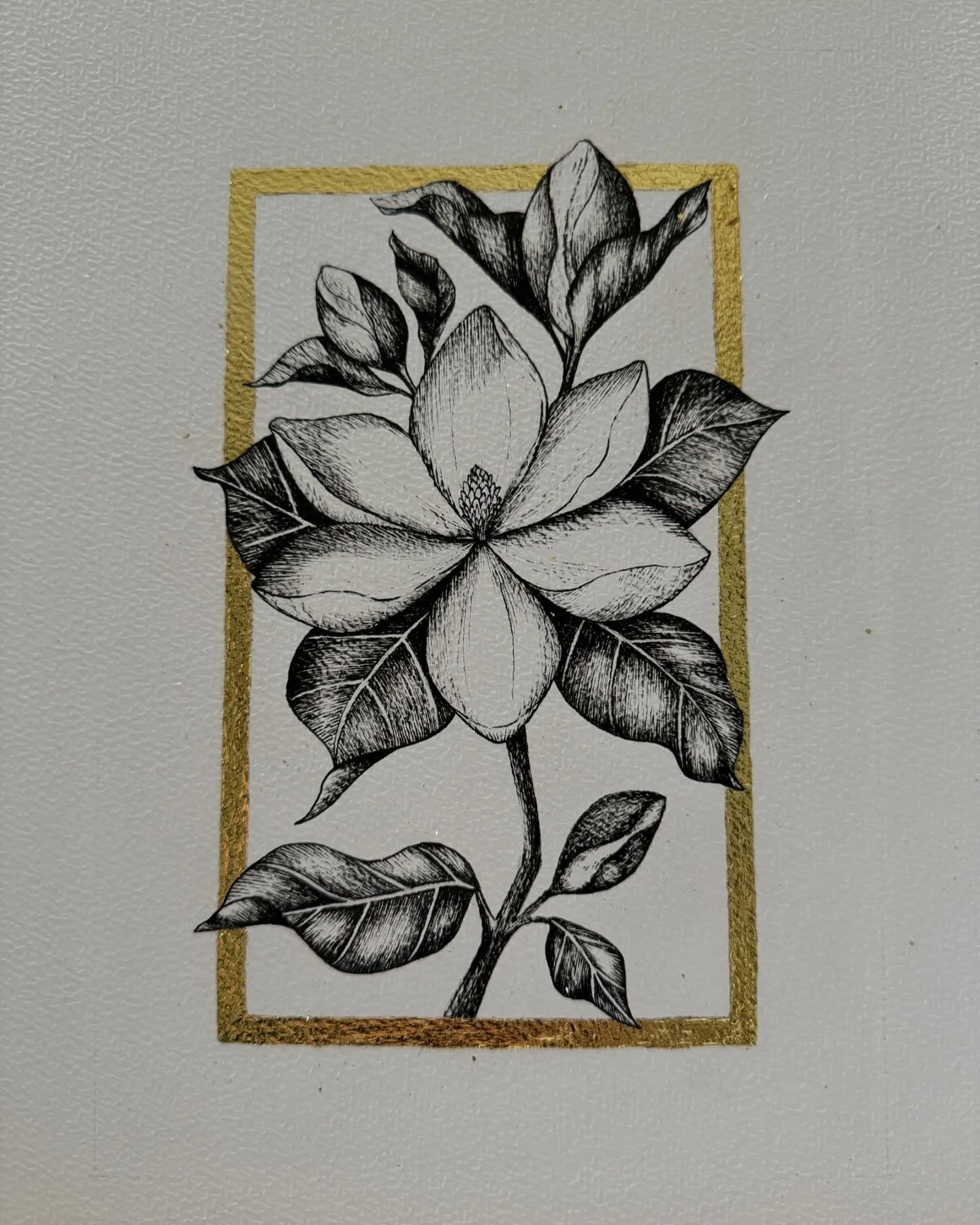 .: Magnolias :. ✍🏼✨

Here&rsquo;s one of my latest commissions displayed in multiple angles. It was created using my classic pen and ink and my signature golden frame, this time gilded!

I simply LOVE drawing magnolias and I had so much fun creating