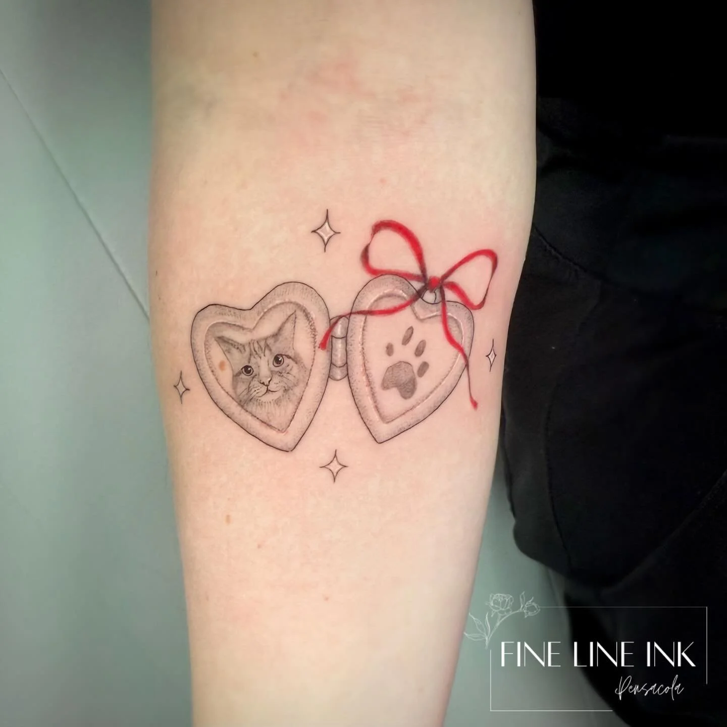 A little locket with her sweet baby boy &amp; his paw print. 

Sweet memorial tattoo for Ginger 🐈

Rest in peace sweet boy &hearts;️

#finelinetattoo#pensacolatattoo#petmemorialtattoo#microrealism