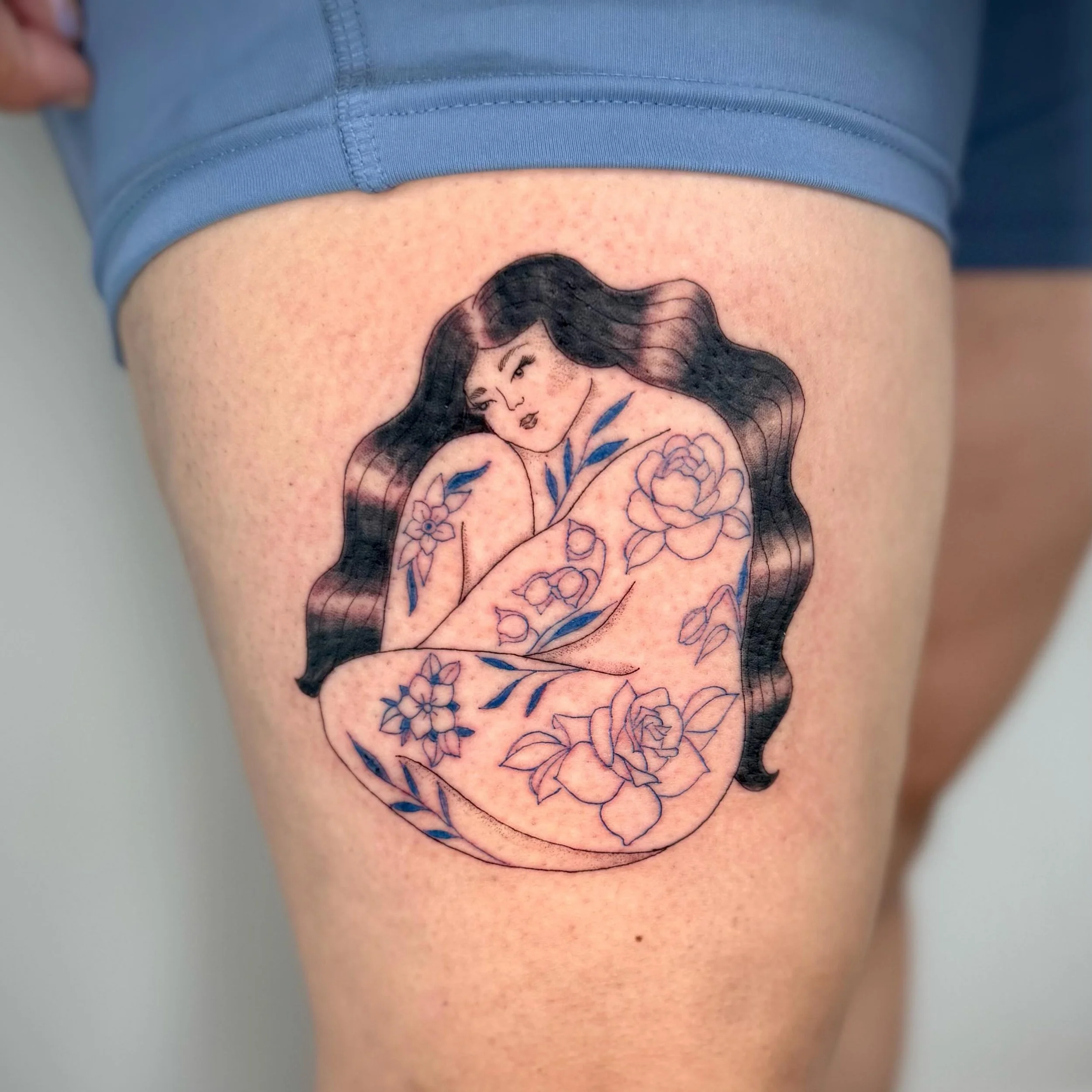My client brought inspo from a drawing she found and we made it more unique to her including her babies birth flowers, curly hair and a plus size frame. 

Love the pop of blue for her tattoos 💙

#finelinetattoo#pensacolatattoo#finelinetattoopensacol