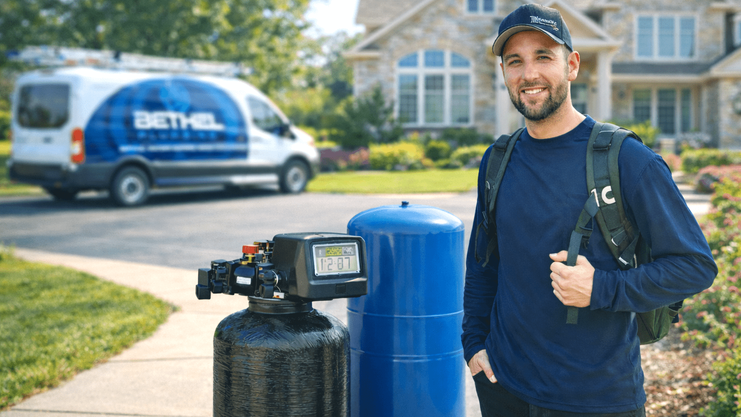 Bethel technician next to a water softener install