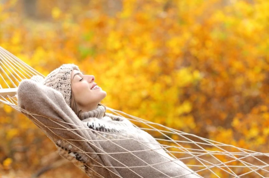 Relaxed young adult in a hammock on an autumn day—calmer moments after complex trauma/CPTSD therapy in Bryn Mawr & Newark, DE.
