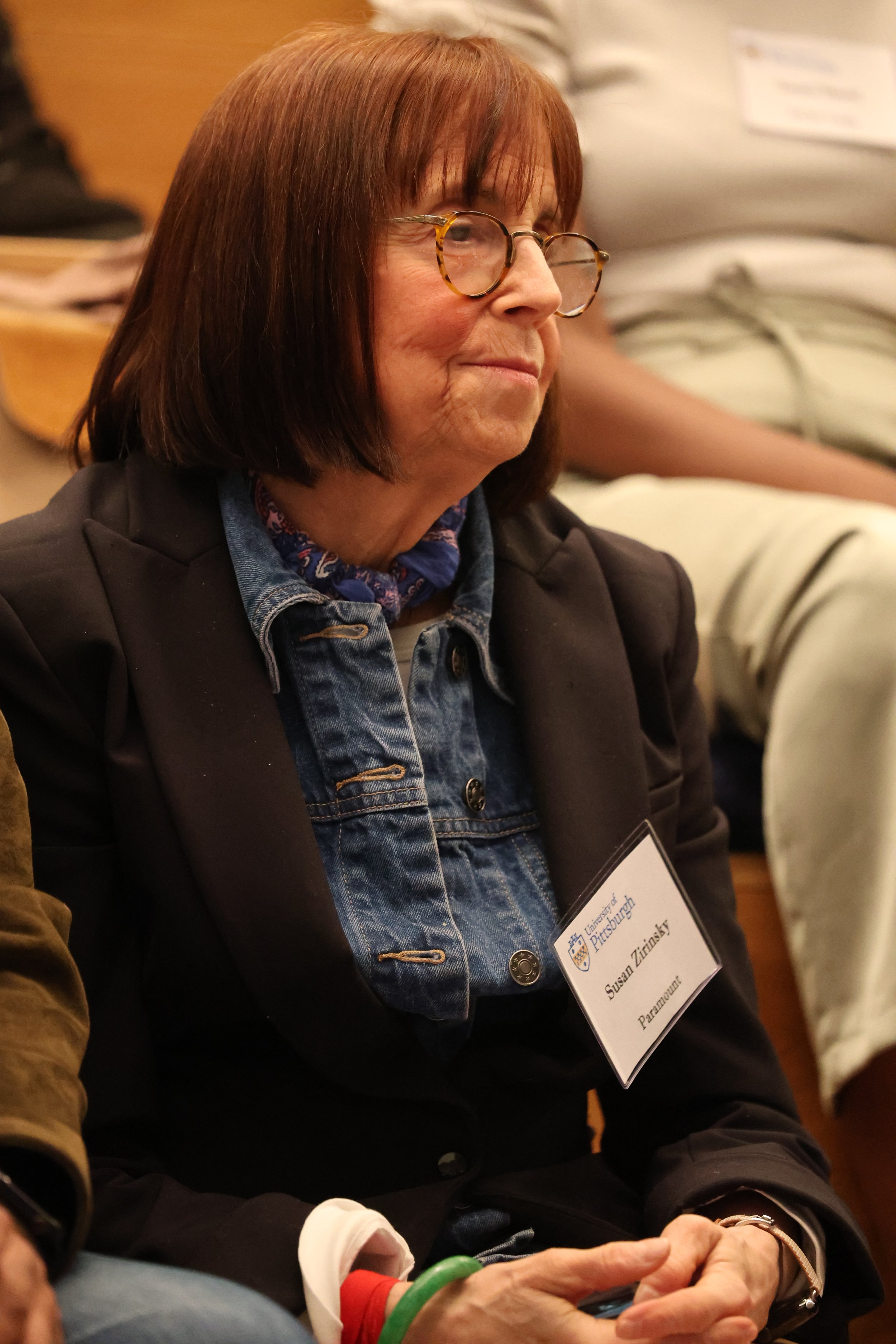 Susan Zirinsky looks on
