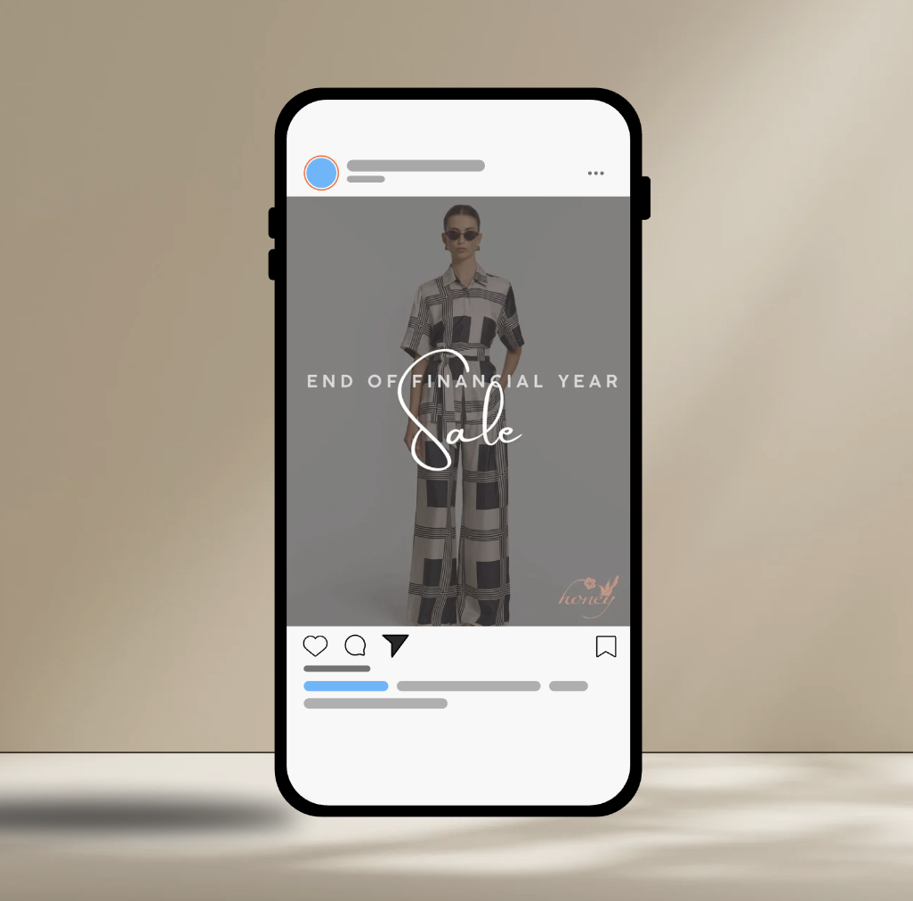 Smartphone displaying an Instagram post featuring a woman in black and white patterned outfit, wearing sunglasses, promoting a sale for the end of the financial year.