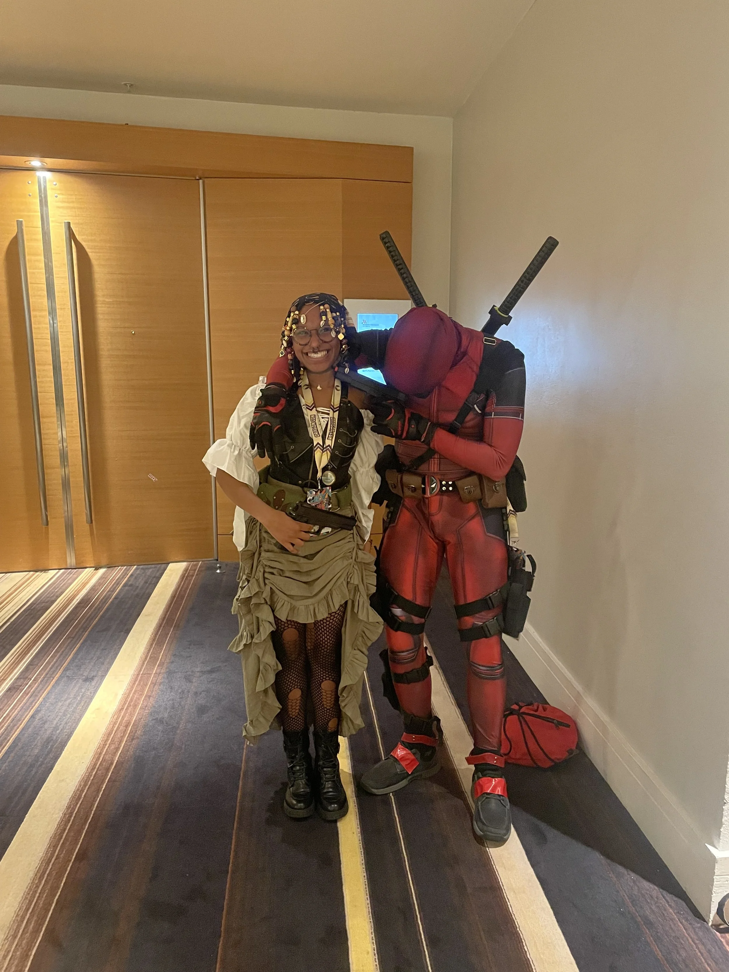 Afromuse Arts @ Dragon Con 2025 Photographed with Deadpool