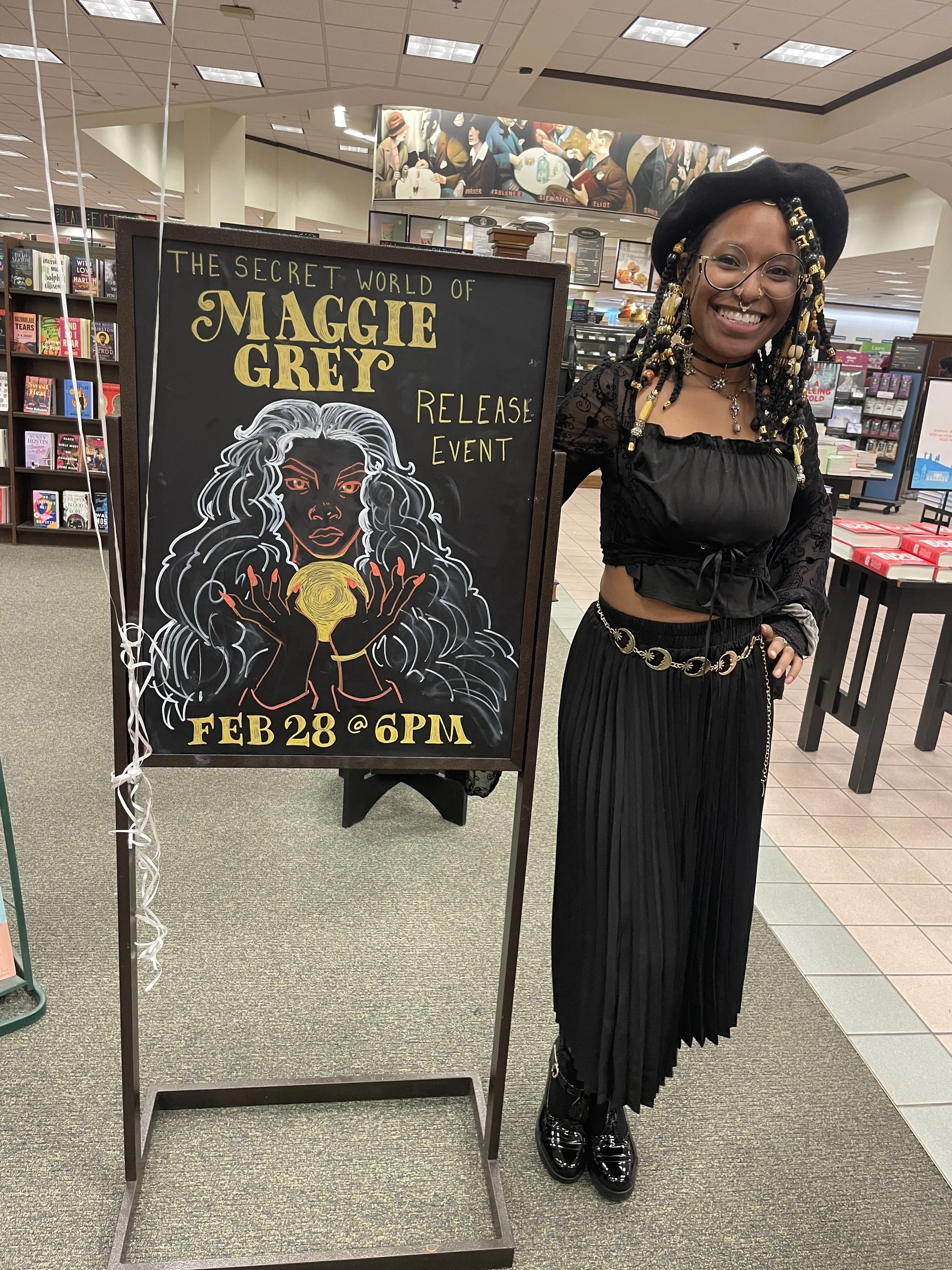 Afromuse Arts photographed at "The Secret World of Maggie Grey" book signing.