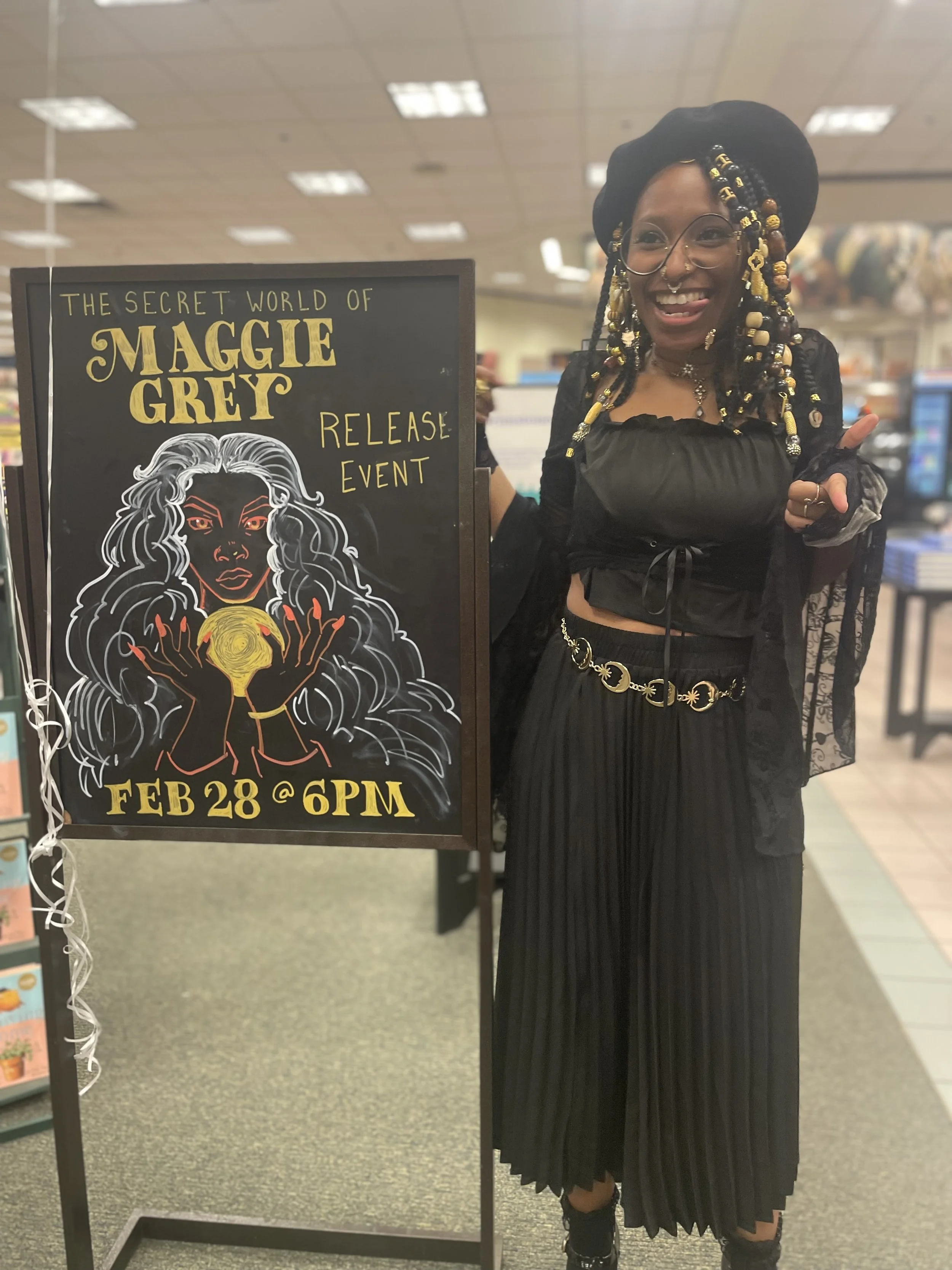 Afromuse Arts photographed at "The Secret World of Maggie Grey" book signing in cosplay.