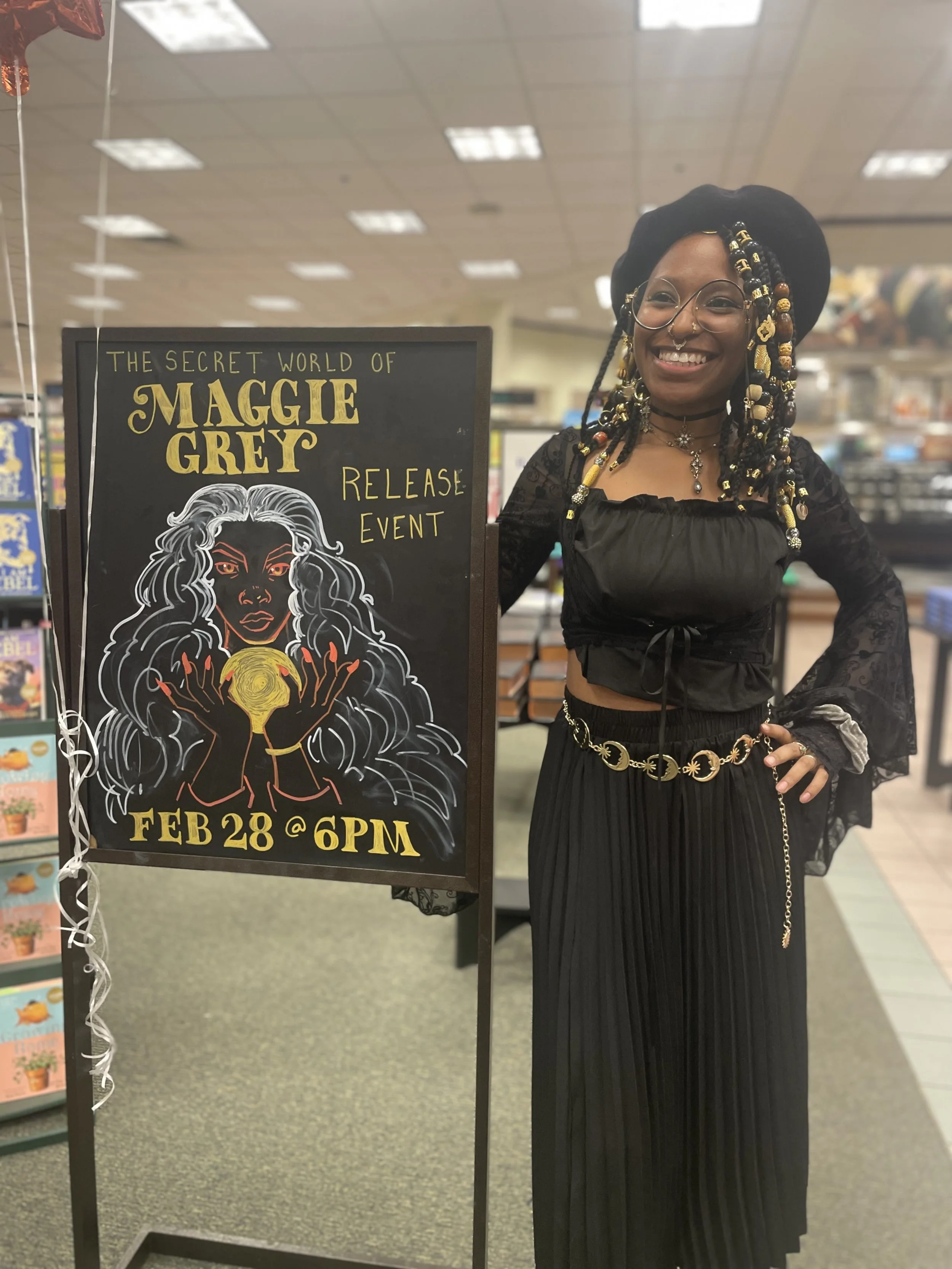 Afromuse Arts photographed at "The Secret World of Maggie Grey" book signing in cosplay.