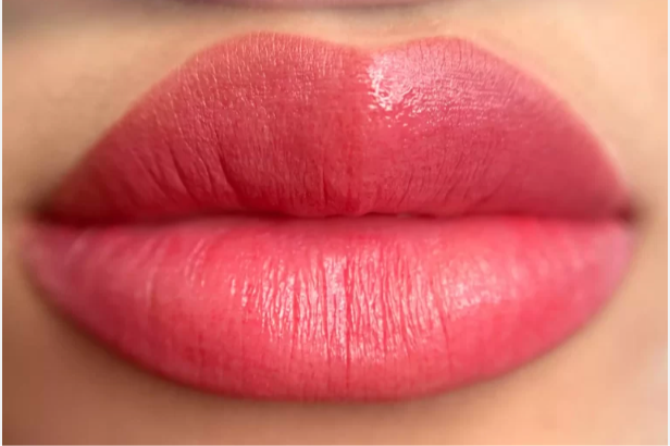 Close-up of a person's lips before and after applying lipstick. The top shows natural lips, and the bottom shows lips with pink lipstick.