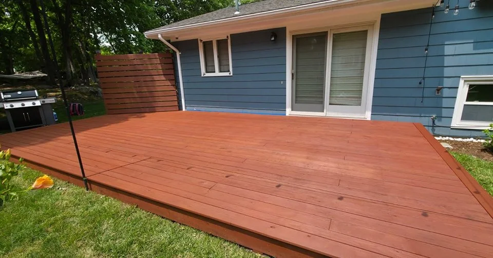 Oil solid stain is a much better choice long term for both intial cost and maintenence. Unlike latex solid stain or paint, oil penetrates into the wood. Oil does not buckle or peel it only fades. Semi solid oil or solid oil is a one coat application
