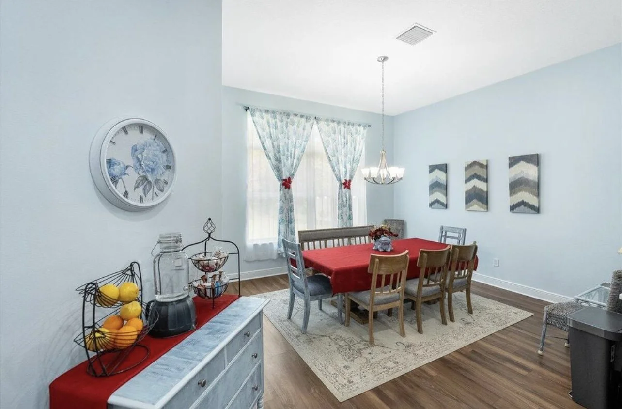 Before image:
Changed window treatments so they were not a focal point along with the red fabric.