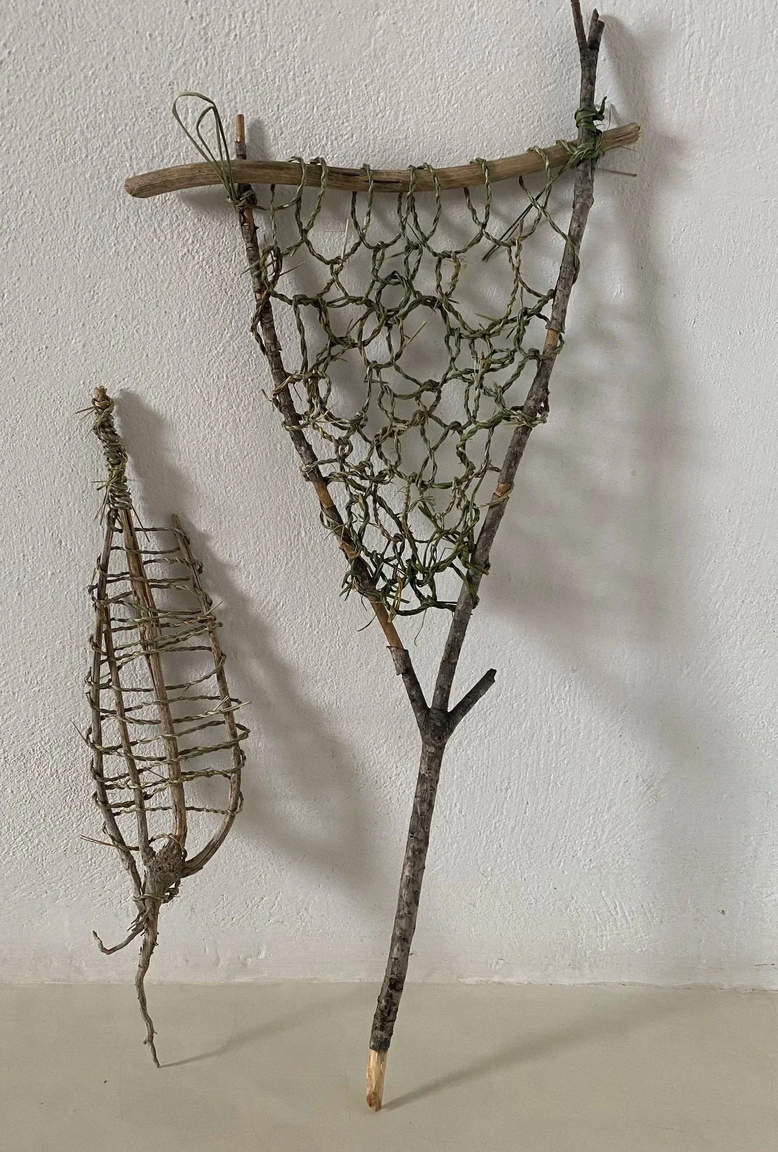 Natural weaving of grass based twine into series of loops