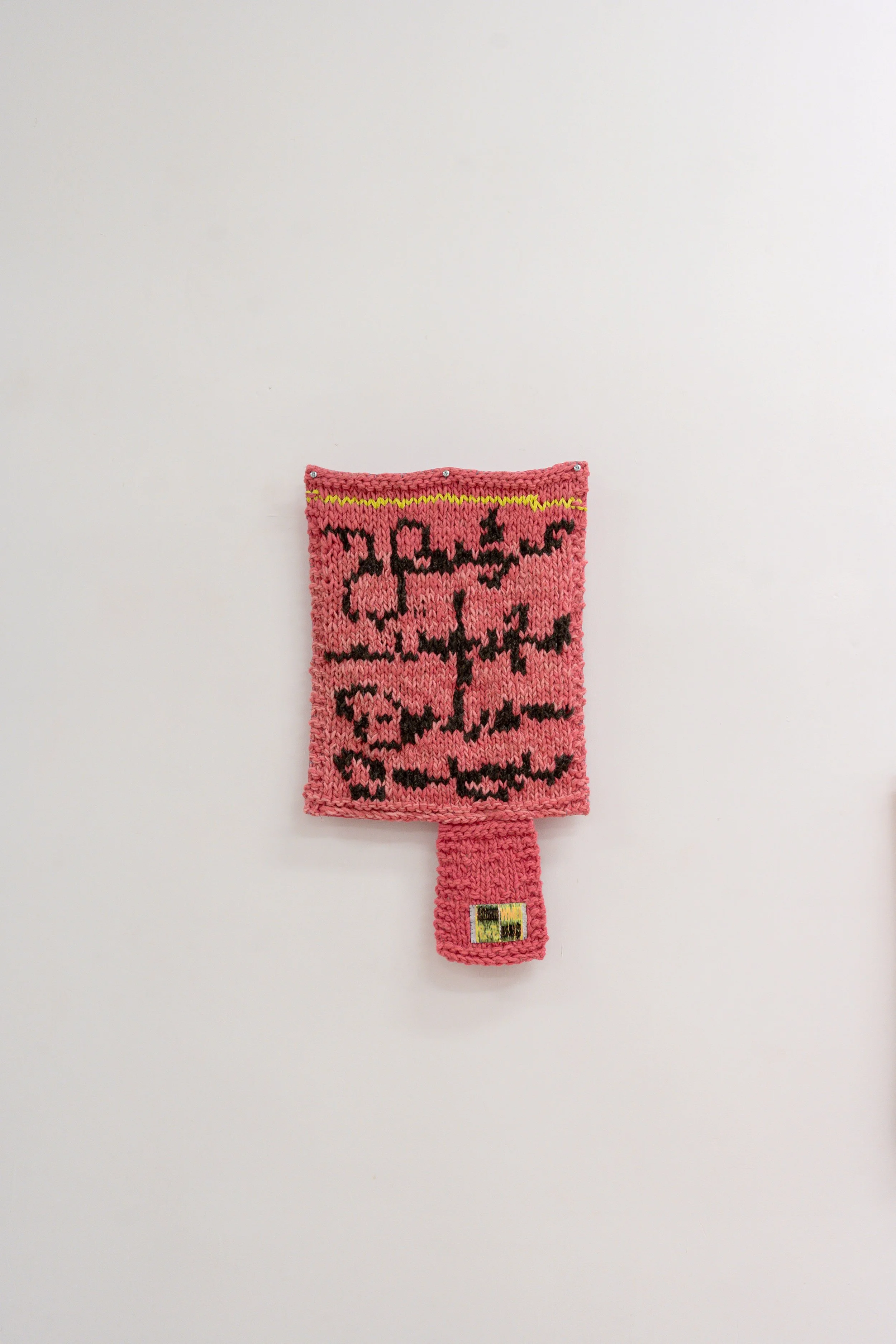 Nota Rosa , 2026 // Wool, fabric and steel eyelets (Knitting and crochet. Hand sewing)// 64 x 37 x 3 cm