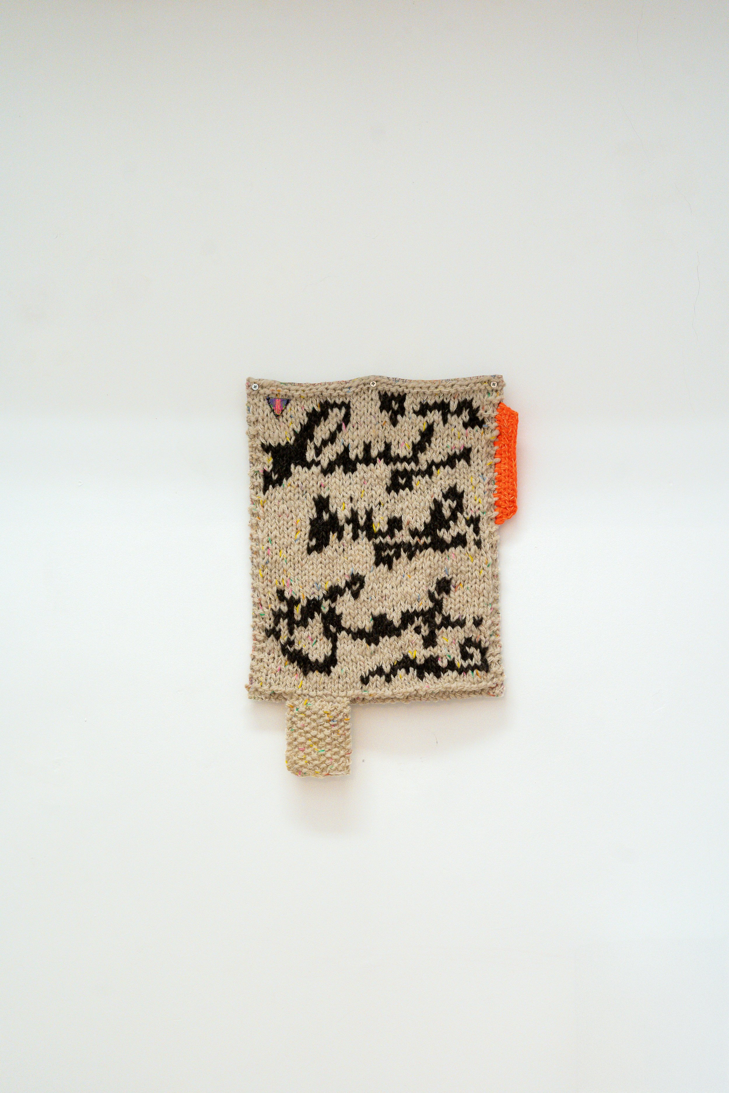 Nota multicolor, 2026 // Wool, fabric and steel eyelets (Knitting and crochet. Hand sewing) // 68 x 40 x 3 cm