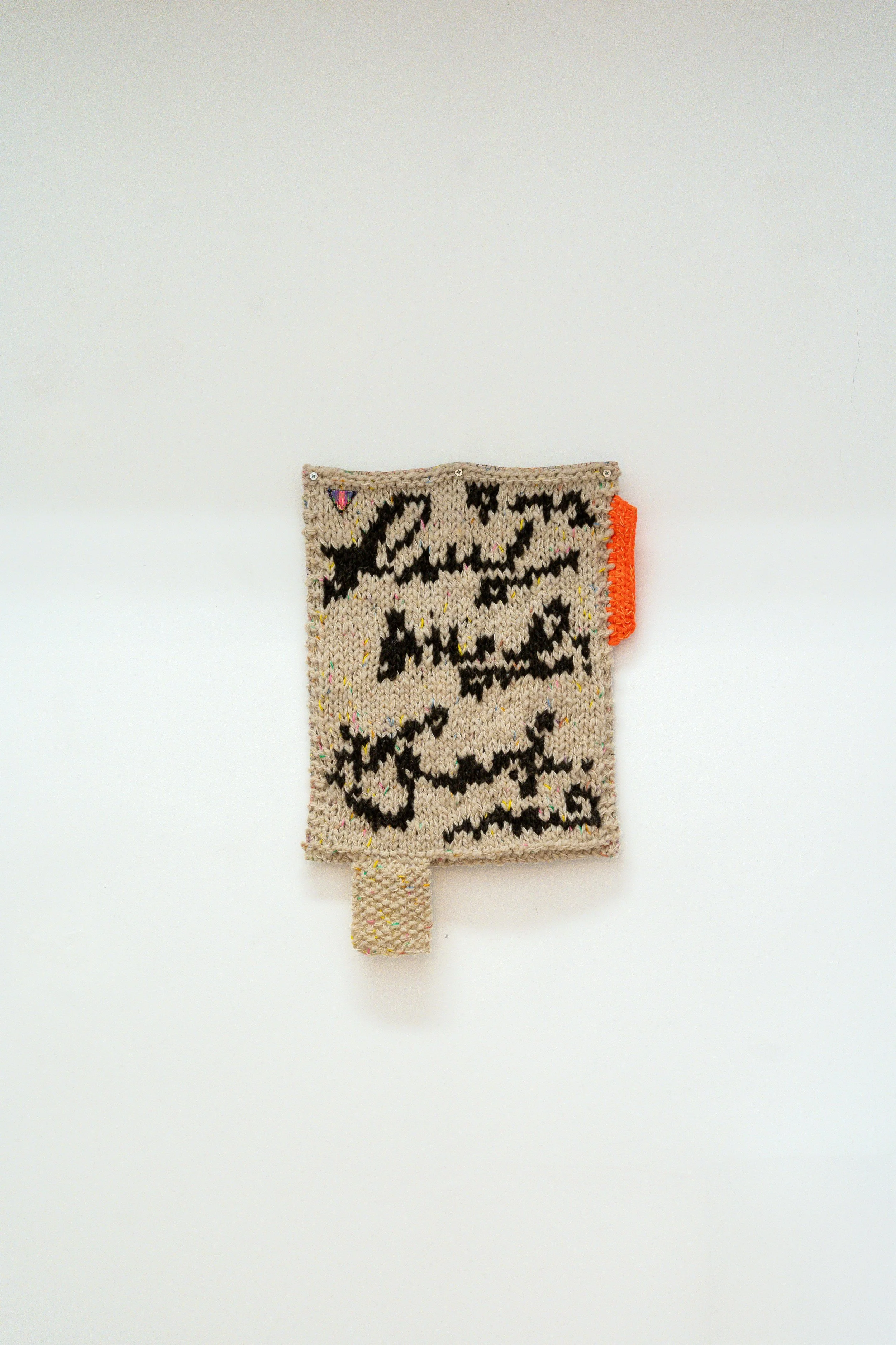 Nota multicolor, 2026 // Wool, fabric and steel eyelets (Knitting and crochet. Hand sewing) // 68 x 40 x 3 cm