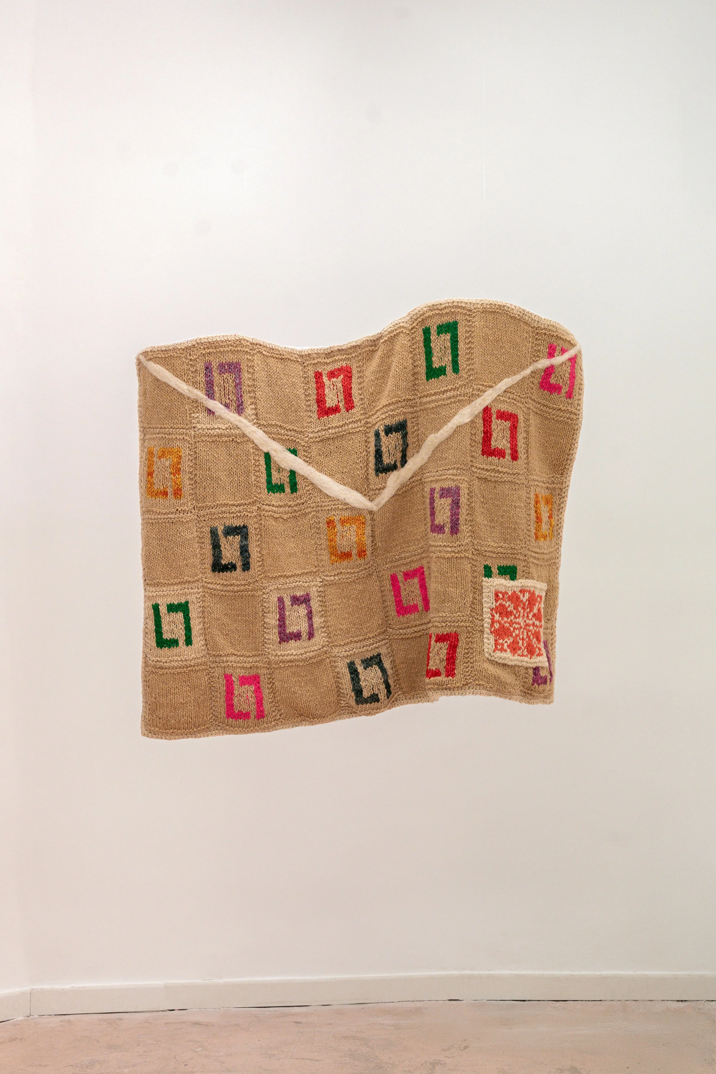 Carta para mí, 2026 // Wool, fabric of different types, and felt. (Knitting with two needles and crochet, hand sewing and machine sewing) // 92 x 126 x 10 cm
