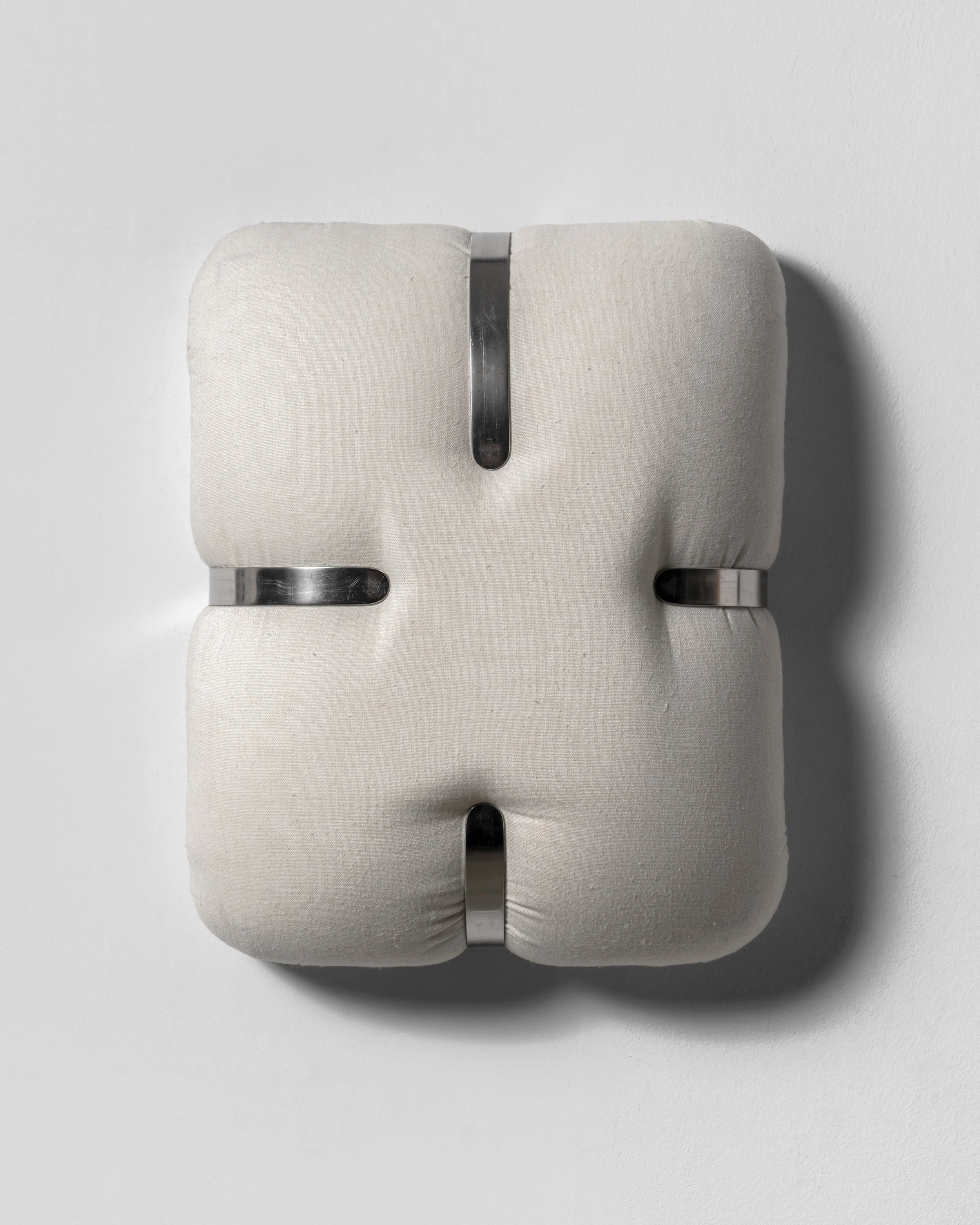 Nikolay Morgunov // e.0-g.b, 2025 // Linen, foam, handcrafted stainless steel brackets, mixed media // 36 x 28 cm