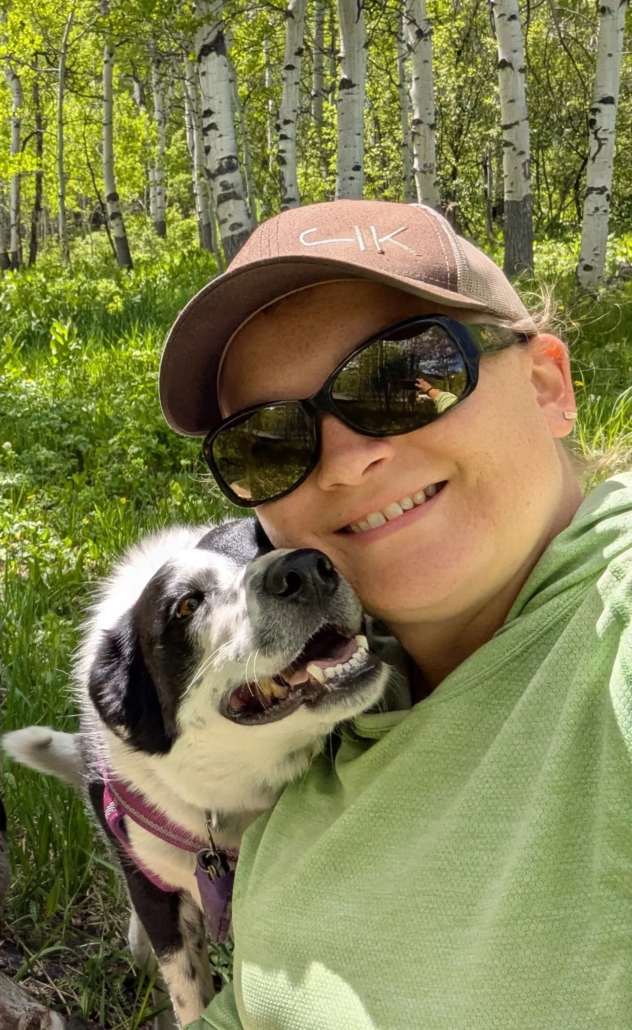 One of the CVT with her dog in the forest 