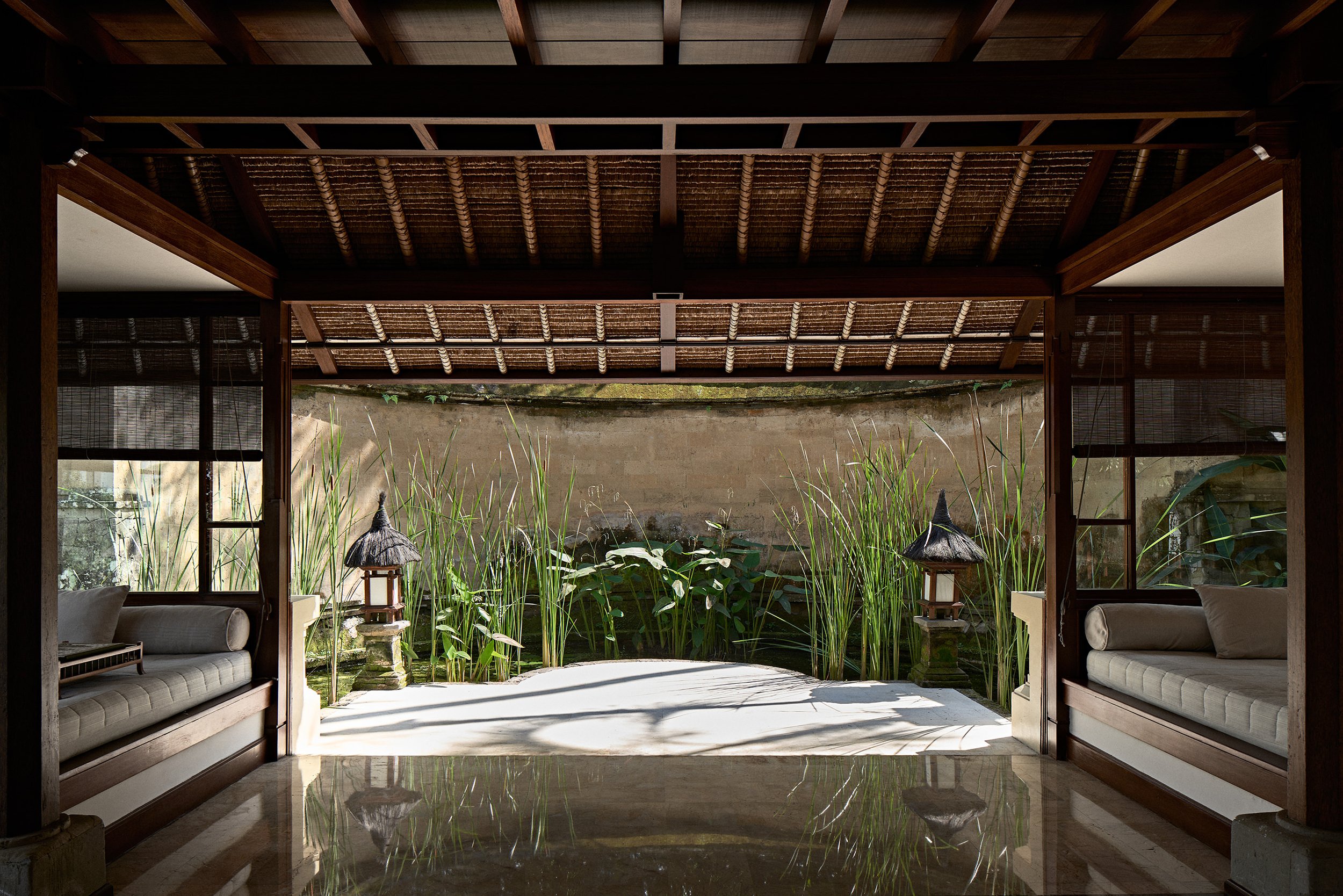 view of private garden in luxury suite with daybeds at aman hotel bali amandari
