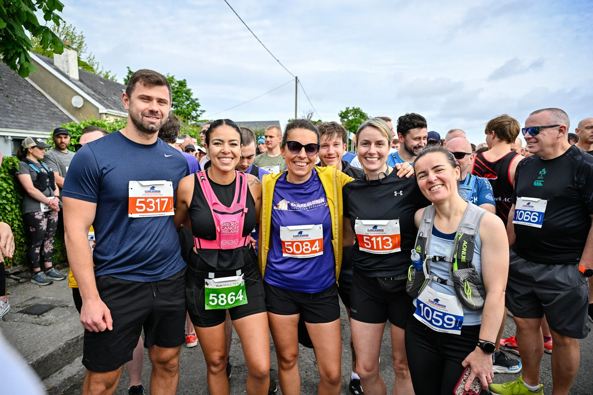 Runners smiling for a group photo ahead of the Clare Burren Marathon Challenge 2026